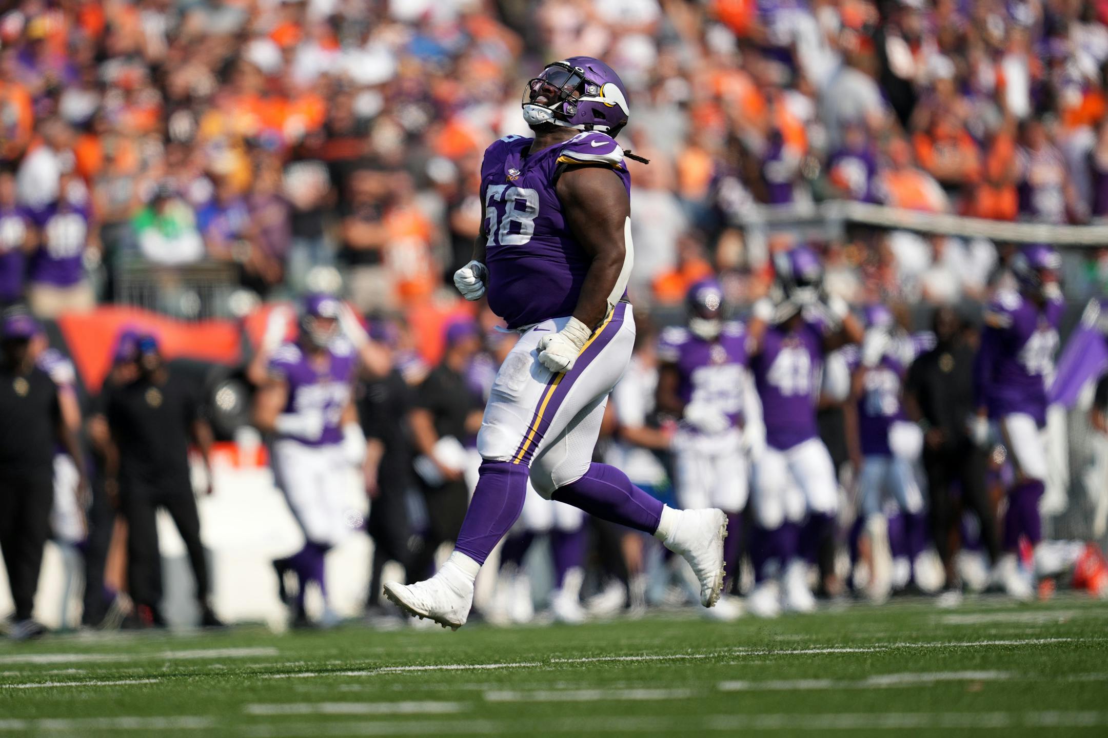 Minnesota Vikings defensive tackle Michael Pierce (58) ran down the field celebrating after he sacked Cincinnati Bengals quarterback Joe Burrow (9) in overtime.