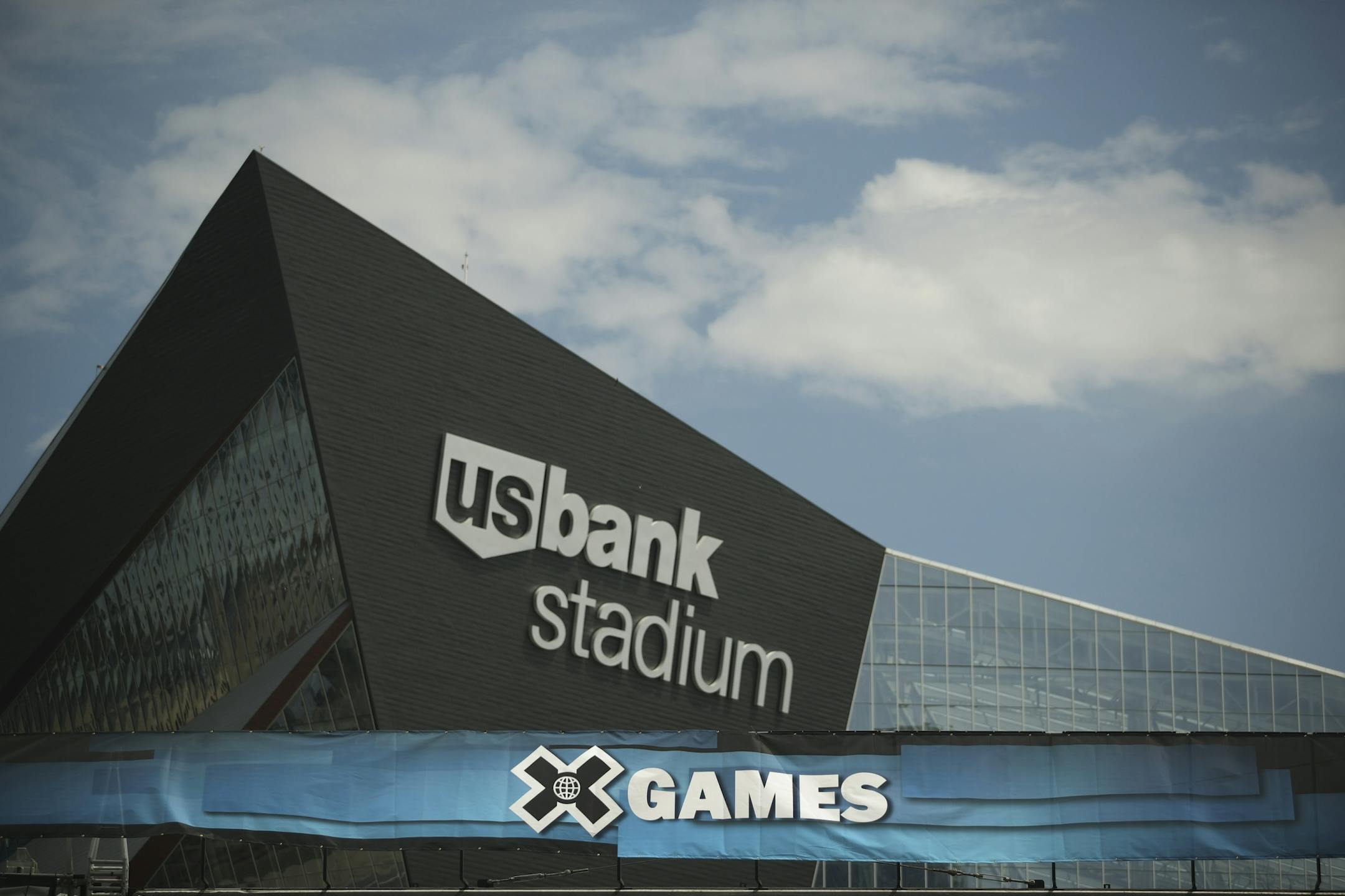 Signage on the top of the stage being assembled in The Commons Park across from U.S. Bank Stadium.