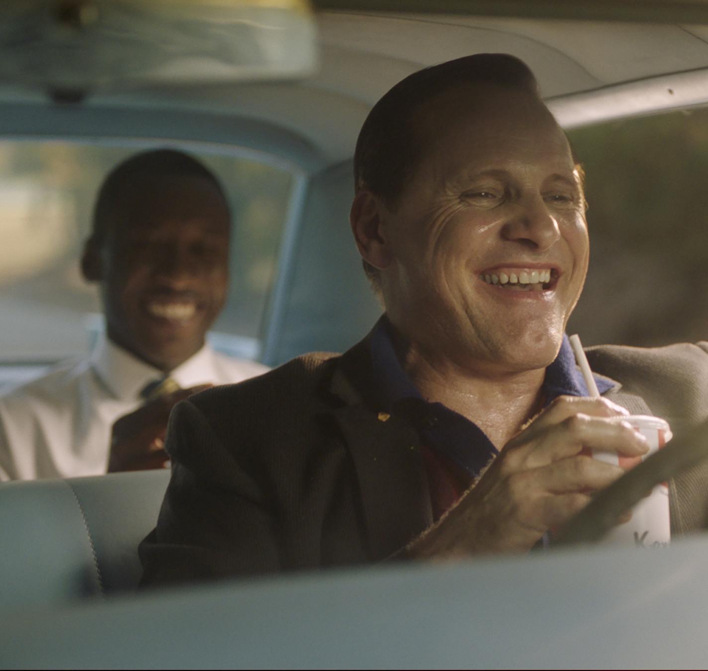 This image released by Universal Pictures shows Viggo Mortensen, foreground, and Mahershala Ali in a scene from "Green Book." (Universal Pictures via AP)