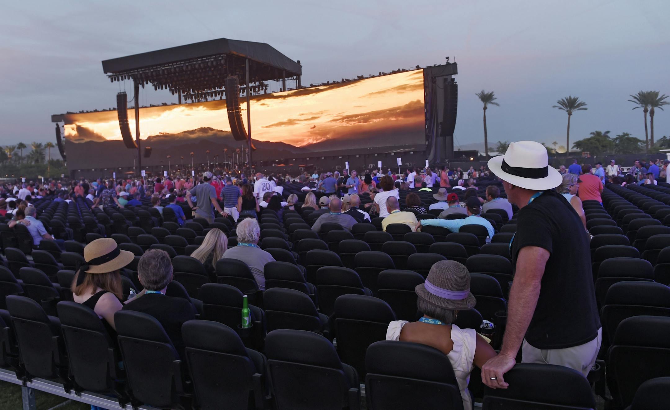 Festival goers wait for Bob Dylan's set to begin in the early evening on day 1 of the 2016 Desert Trip music festival at Empire Polo Field on Friday, Oct. 7, 2016, in Indio, Calif.