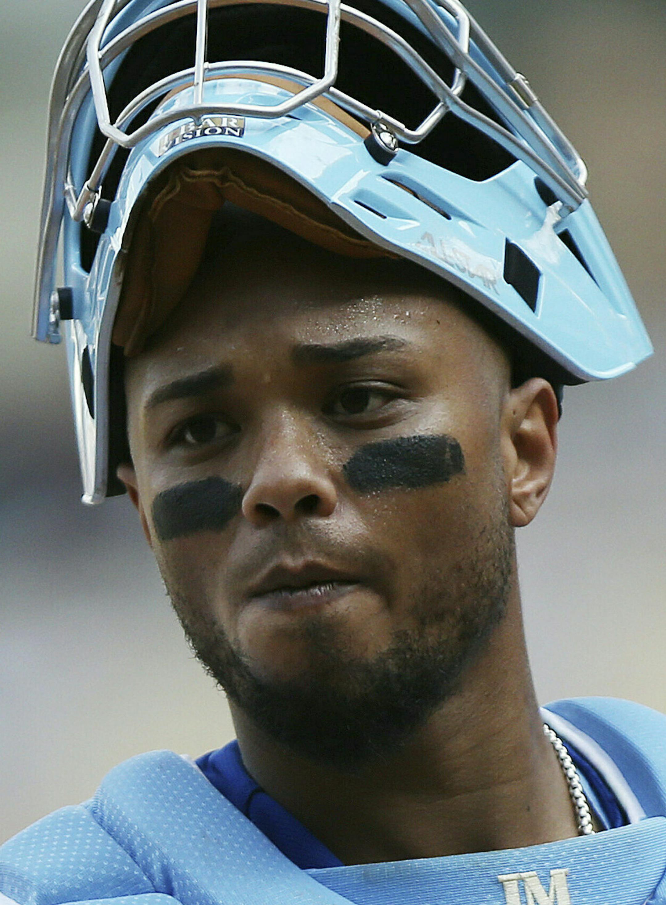 Kansas City Royals' Martin Maldonado looks on during a baseball game against the Minnesota Twins, Sunday, June 16, 2019, in Minneapolis. Maldonado celebrated Father's Day by wearing a blue necktie on his chest protector and had three hits to lift the Kansas City Royals over the Minnesota Twins 8-6 on Sunday. (AP Photo/Stacy Bengs)