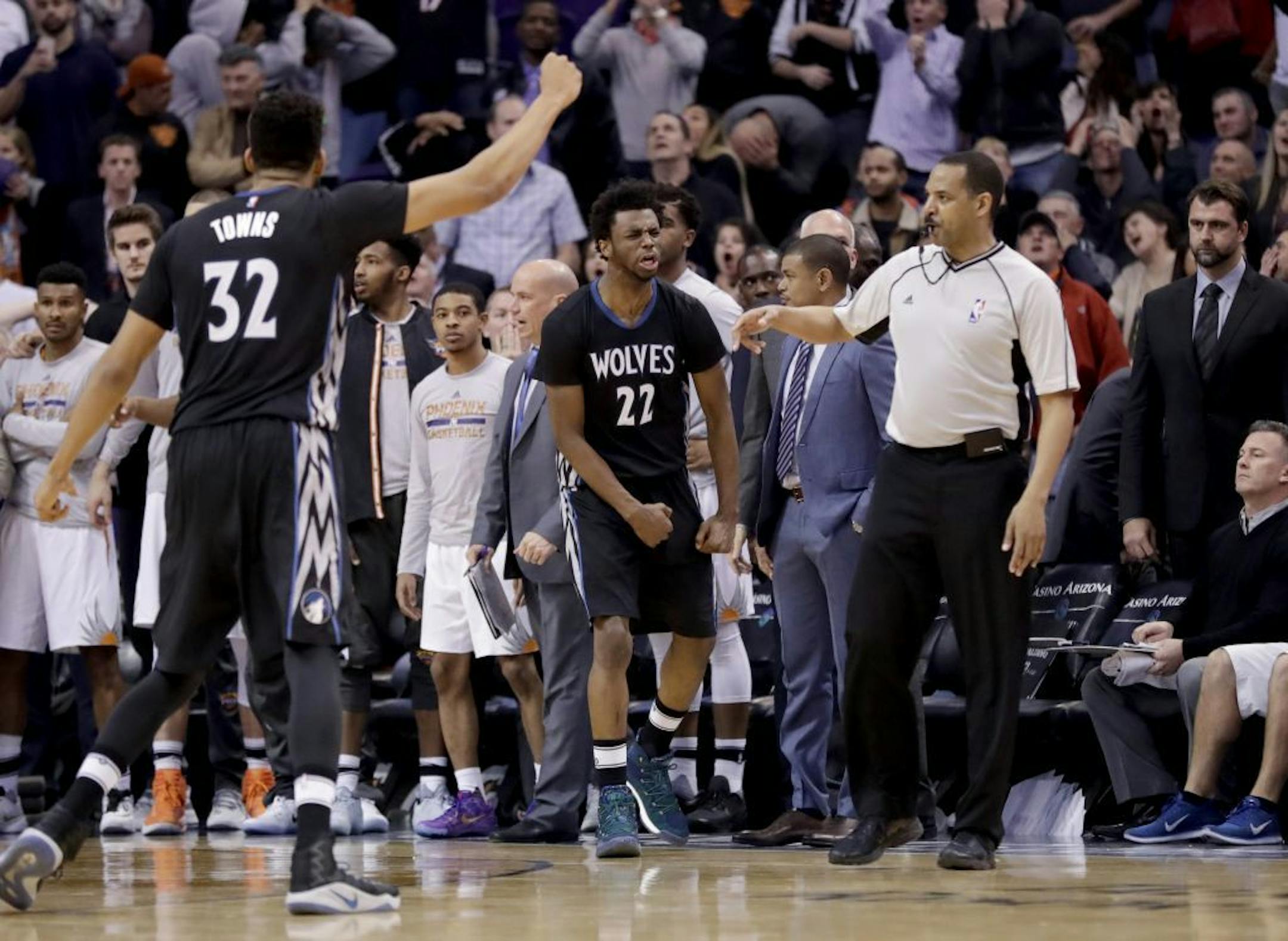 Minnesota Timberwolves forward Andrew Wiggins (22) reacts to making the game winning basket against the Phoenix Suns as time expires during the second half of an NBA basketball game, Tuesday, Jan. 24, 2017, in Phoenix. The Timberwolves won 112-111.