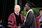 President Joe Biden, left, stands with valedictorian DeAngelo Jeremiah Fletcher at the Morehouse College commencement Sunday, May 19, 2024, in Atlanta