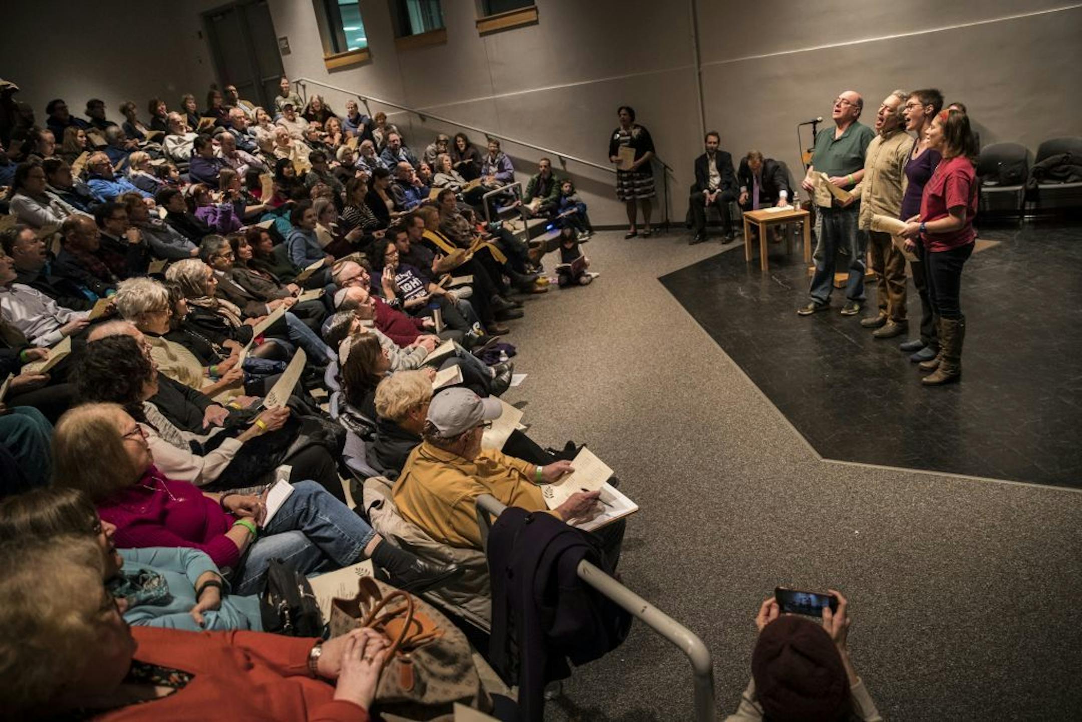 A group of people led a sing-a-long to the hebrew song Hineh Mah Tov at the beginning an interfaith rally at the Highland Park Community Center on Thursday, March 2, 2017, in St. Paul, Minn.