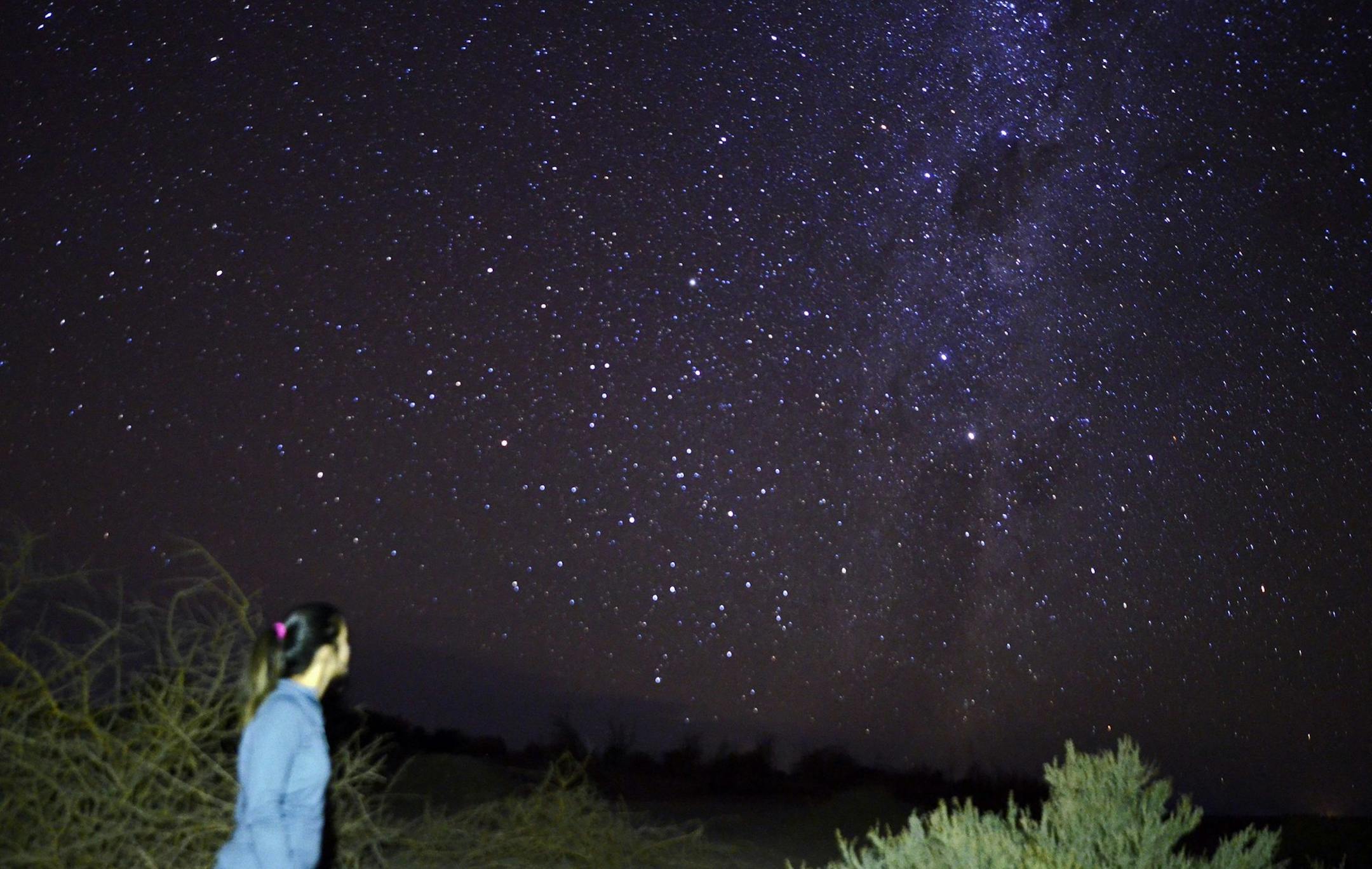 Maria Paz Navarro gets a look at the Milky Way outside San Pedro de Atacama in northern Chile, where her company, Astronomic Tour Licanantay Observatory, offers stargazing experiences. (Terri Colby/Chicago Tribune/TNS)
