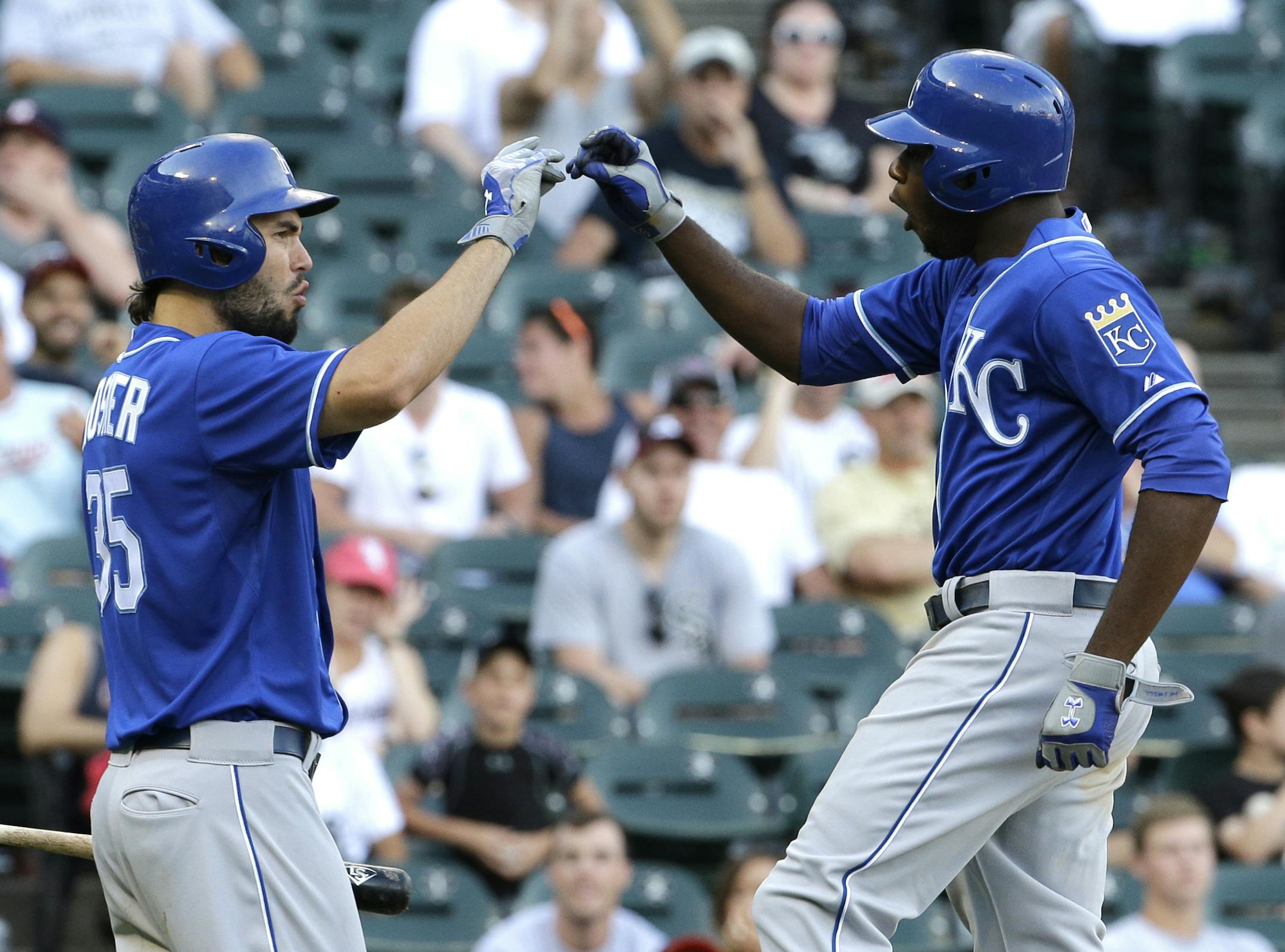 Kansas City Royals' Lorenzo Cain, right, celebrates with teammate Eric Hosmer after hitting a solo home run during the 13th inning of a baseball game against the Chicago White Sox, Saturday, July 18, 2015, in Chicago. The Royals won 7-6. (AP Photo/Nam Y. Huh)