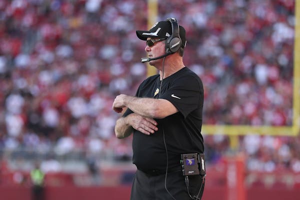 Mike Zimmer watches during the second half of his team’s game against the 49ers.