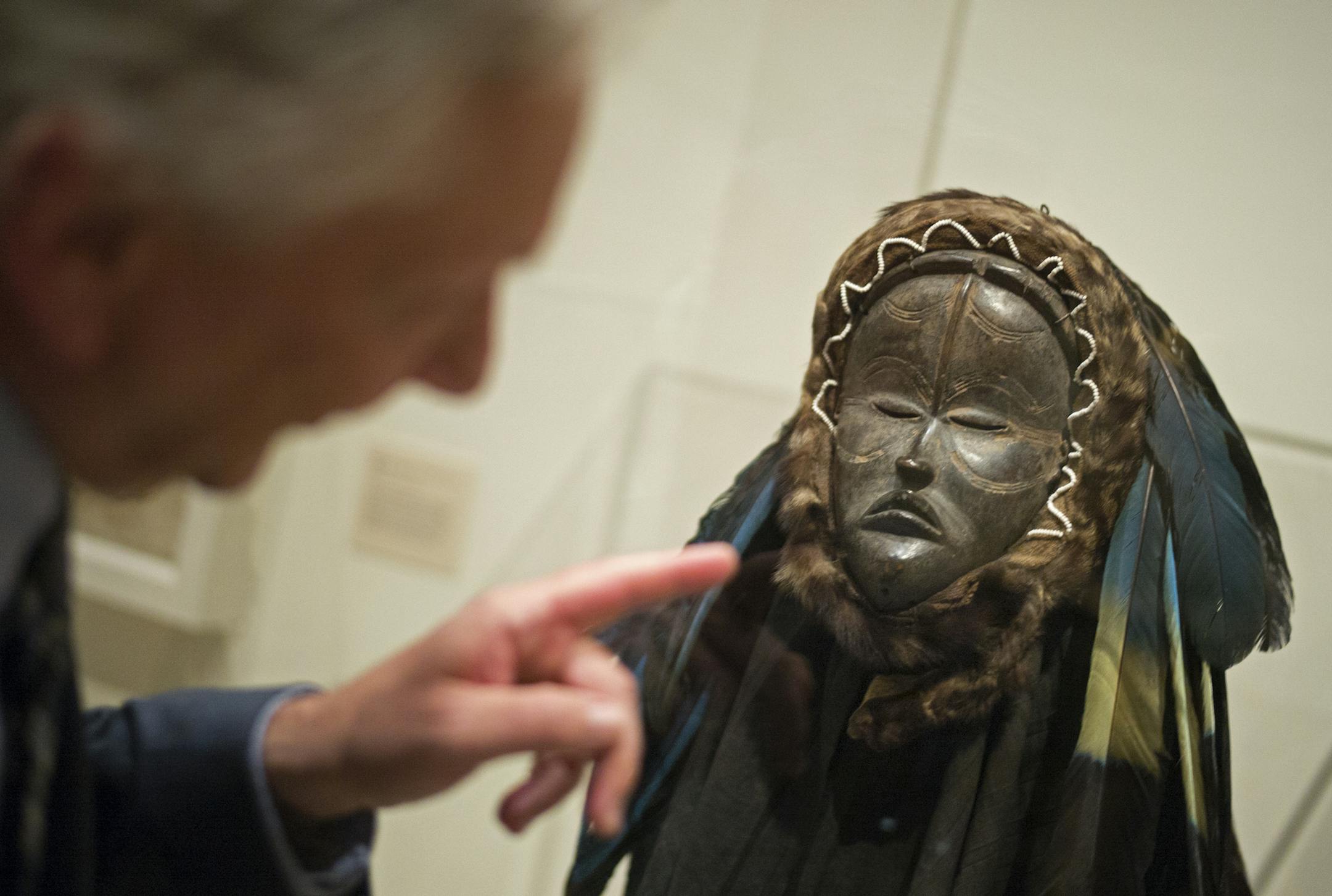 At the Minneapolis Institute of Art, curator Jan-Lodewijk Grootaers showed an exquisite mask with feathers and monkey tail from Liberia collected by William Siegmann from the "Visions of the Forest" exhibitl.]Richard Tsong-Taatarii/rtsong- taatarii@startribune.com