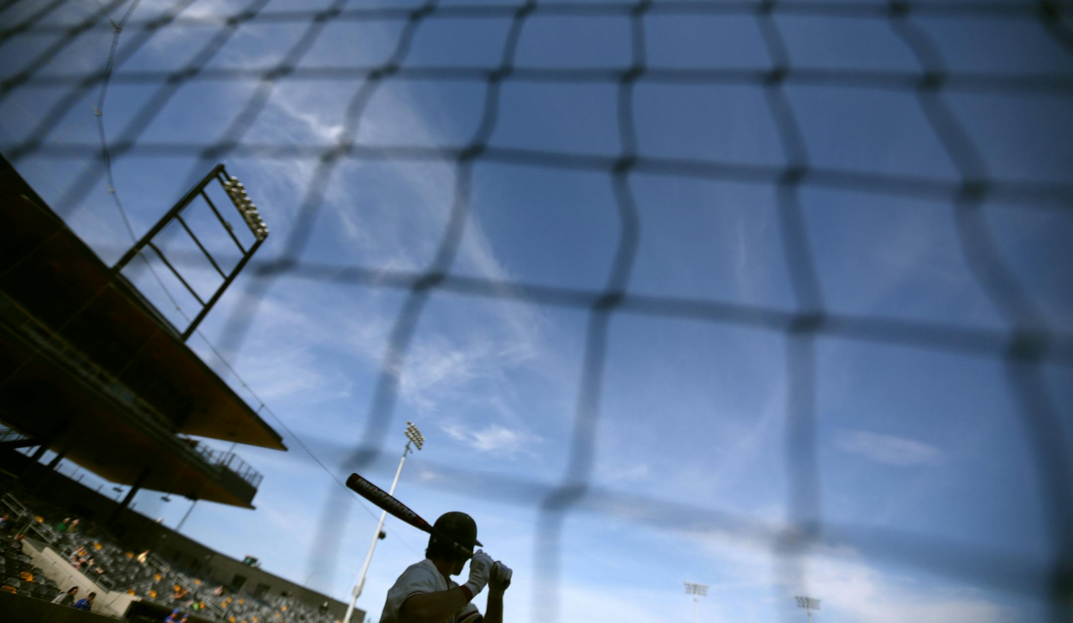 A Hamline batter waits to hit in the on deck circle. Feature on St. Paul baseball history leading up to the opening of a new CHS Field, Hamline played Macalester Wednesday April 15 2015 in St. Paul Minnesota. ] Jerry Holt/ Jerry.Holt@Startribune.com