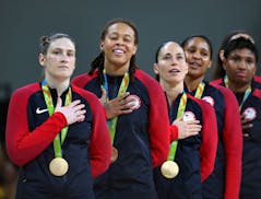 The USA women's basketball team savored the moment during the national anthem after its sixth consecutive gold medal win. Lynx player Lindsey Whalen, 