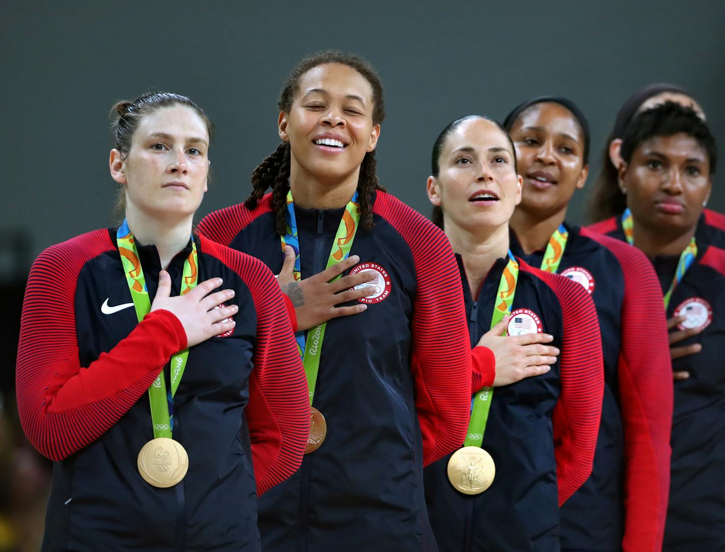 The USA women's basketball team savored the moment during the national anthem after its sixth consecutive gold medal win. Lynx player Lindsey Whalen, front, scored 17 points off the bench in the victory.