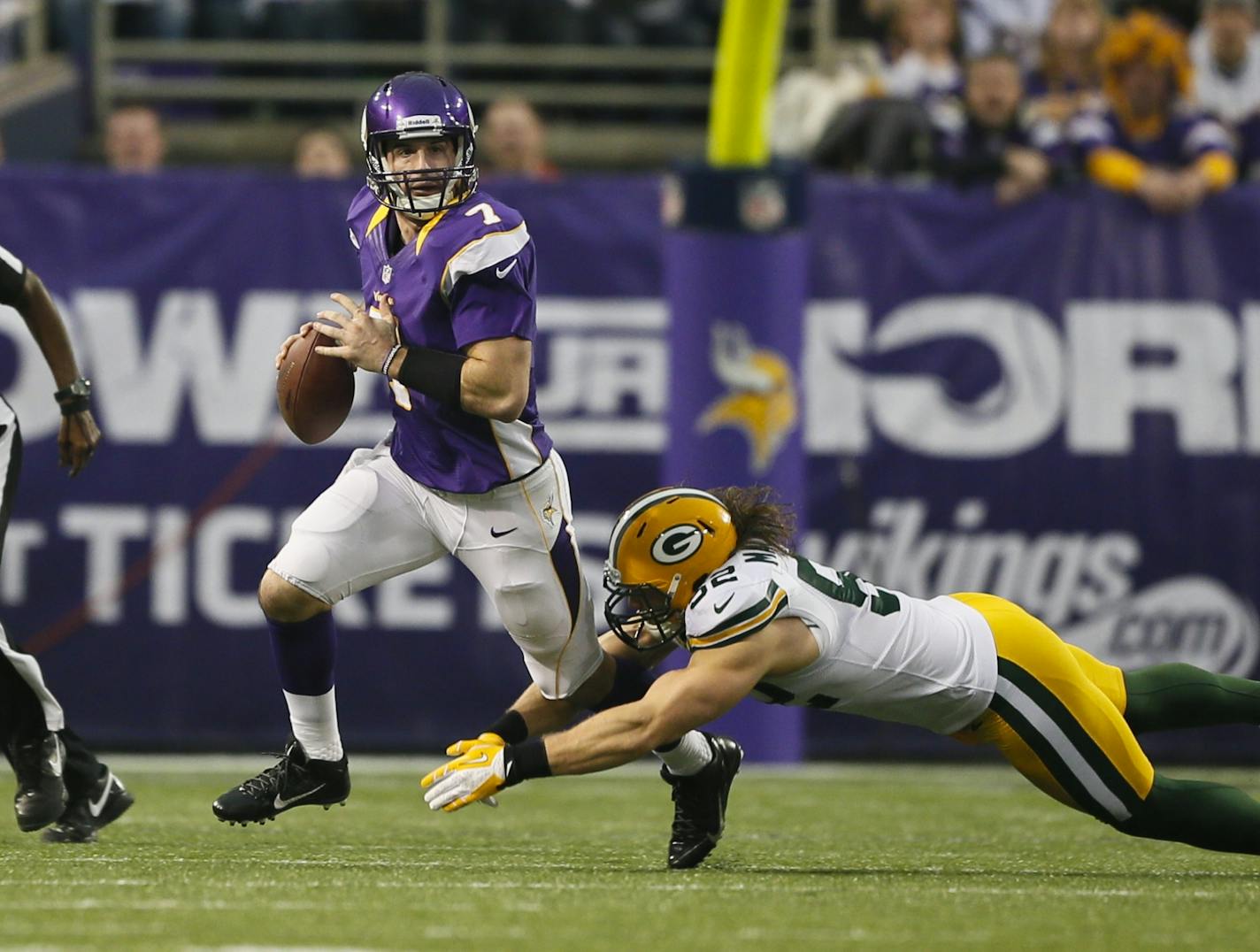 Vikings quarterback Christian Ponder looked to pass before the Packers' Clay Matthews tackled him in the first quarter Sunday.