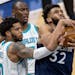 Minnesota Timberwolves' Karl-Anthony Towns (32) was fouled by Miles Bridges (0) of the Charlotte Hornets dunked the ball in the third quarter.