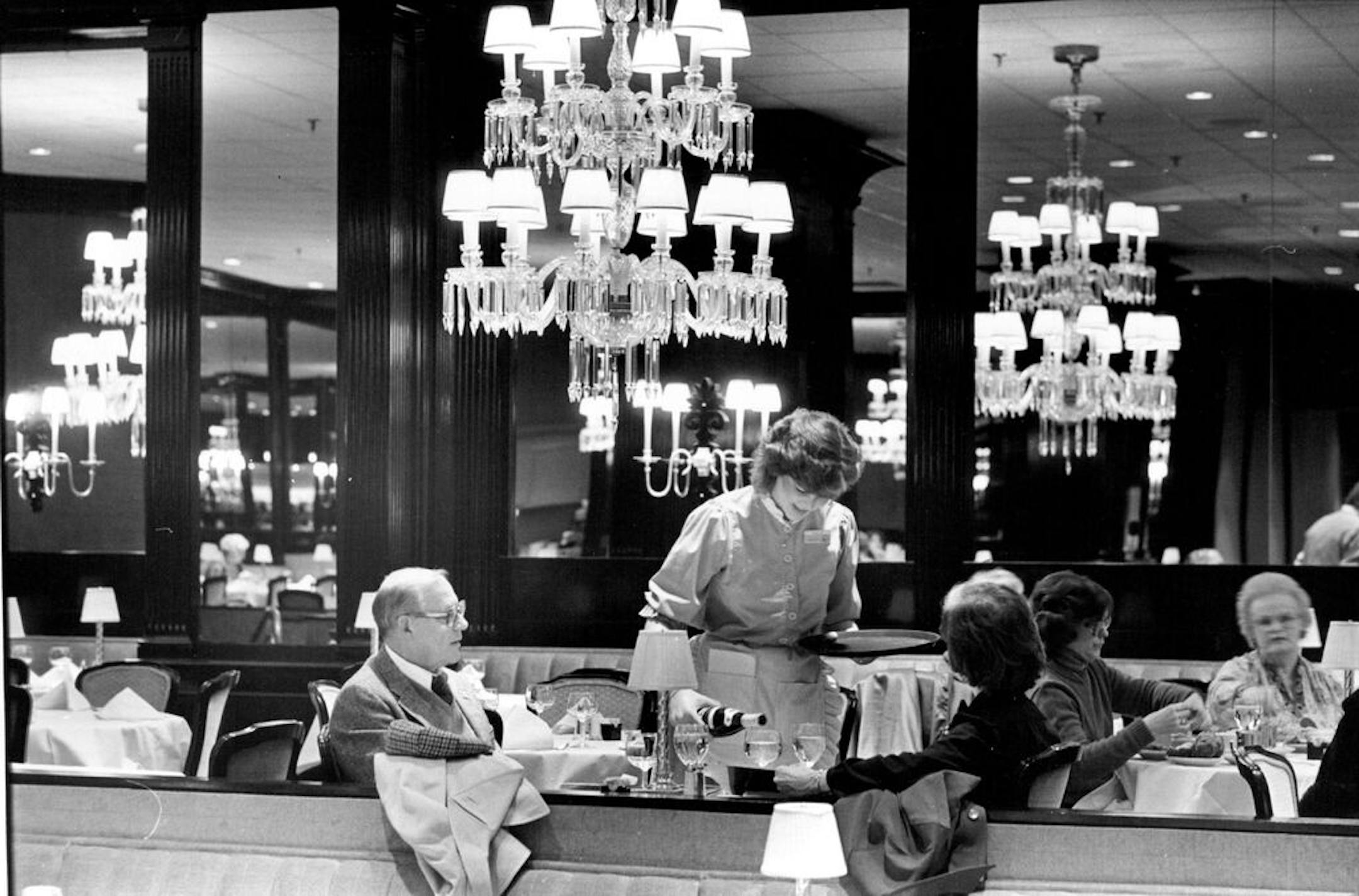 December 9, 1983 Waitress poured wine at Dayton's River Room in St. Paul. December 7, 1983 David Brewster, Minneapolis Star Tribune