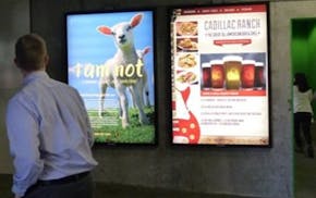 A shopper passes by an anti-wool ad at the Mall of America.