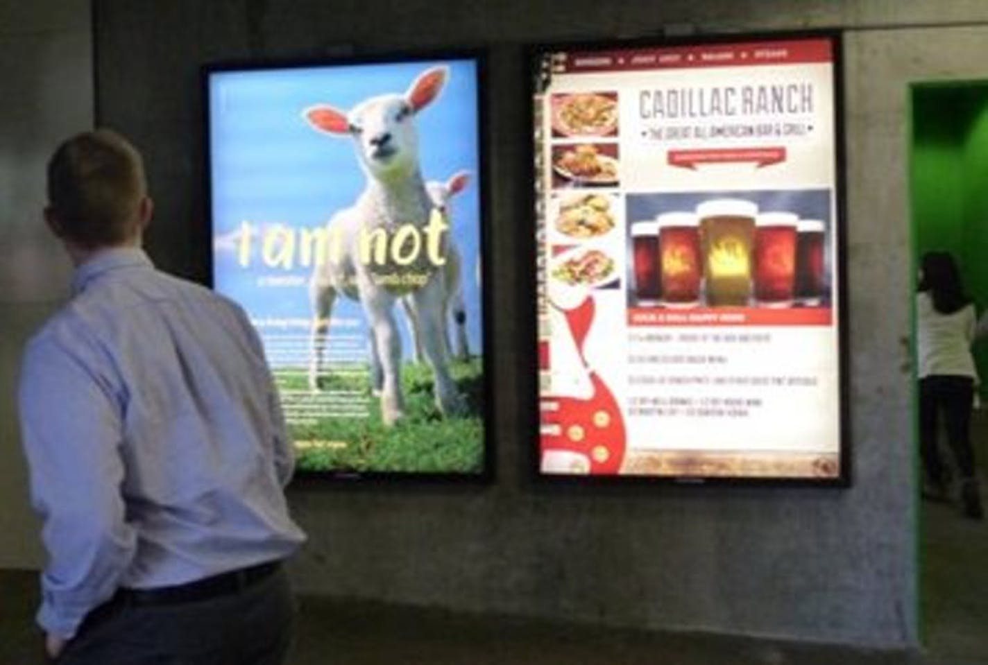 A shopper passes by an anti-wool ad at the Mall of America.