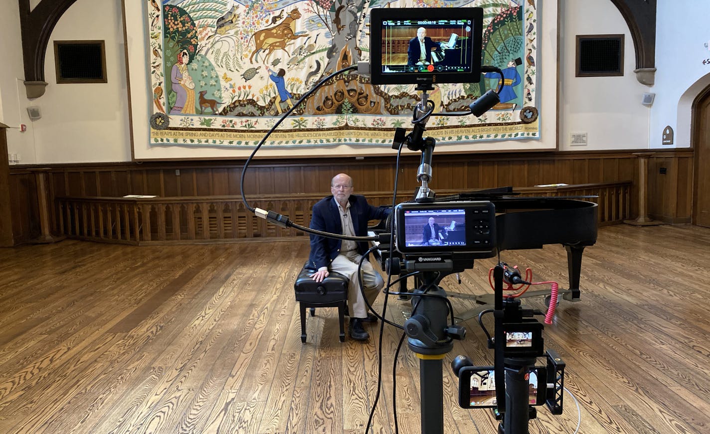 Philip Brunelle at Plymouth Congregational Church, preparing to record a "Musical Moment."