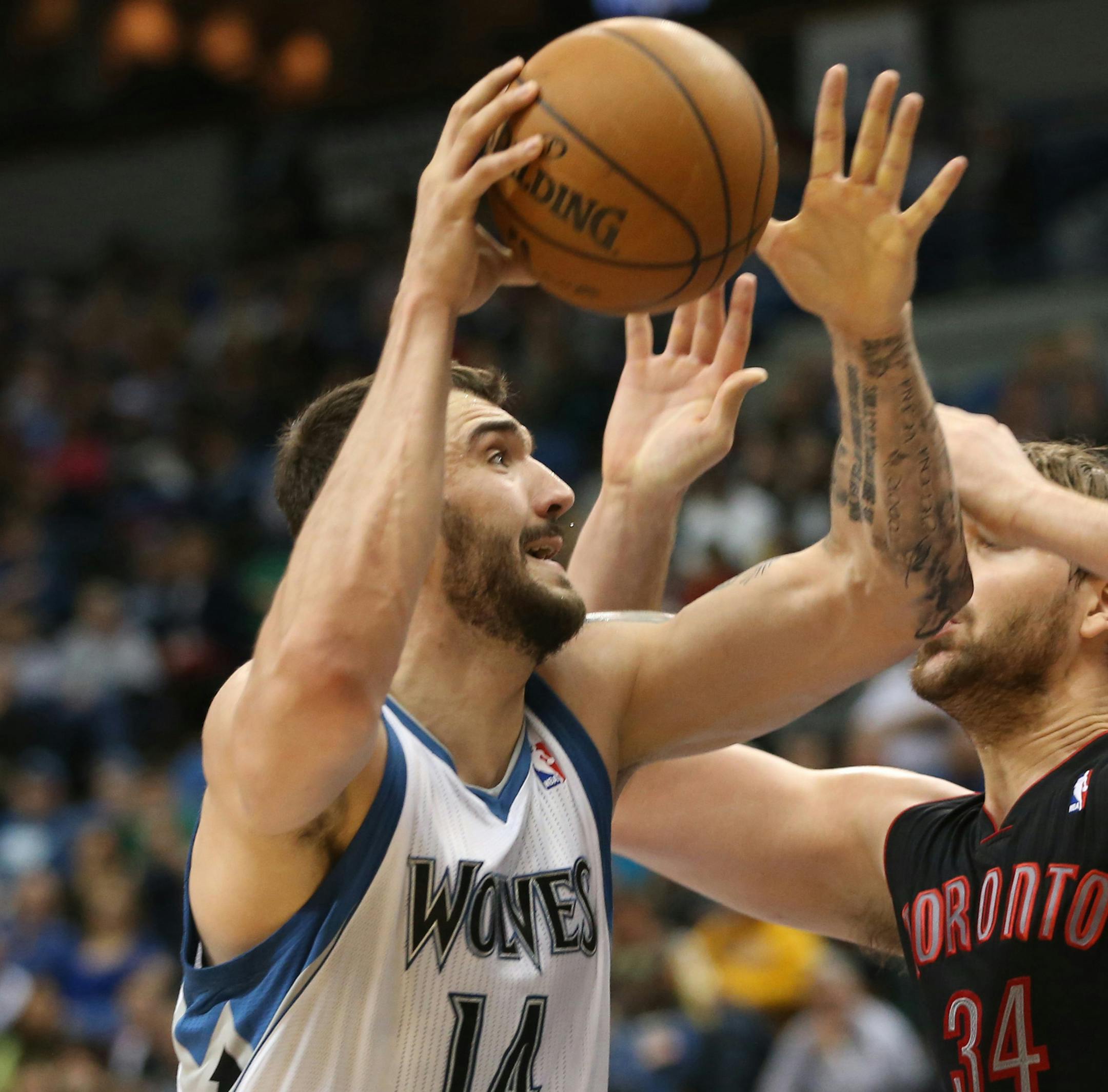 The Minnesota Timberwolves' Nikola Pekovic, left, drives against the Toronto Raptors' Aaron Gray at Target Center in Minneapolis, Minnesota, on Friday, April 5, 2013. Toronto won, 95-93. (Bruce Bisping/Minneapolis Star Tribune/MCT)