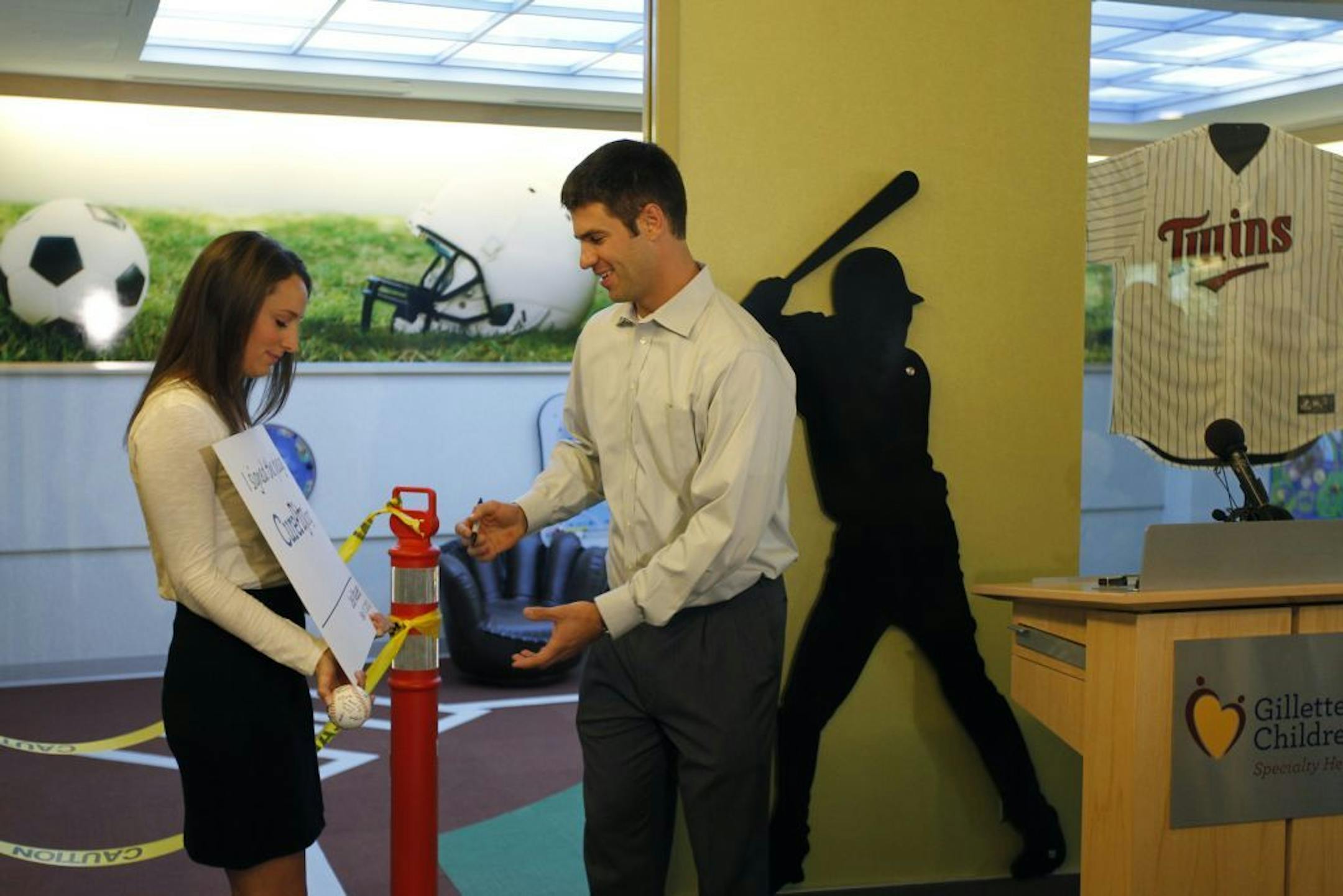 Joe Mauer and his fiancee Maddie Bisanz spent Monday morning at playroom the he donated to Gillette Children's St. Paul Campus. The sports-themed room is 22' long x 14' wide and comes complete with signed memorabilia from professional Minnesota teams, including the Twins and Vikings. in St. Paul, Minnesota Monday September 10, 2012.