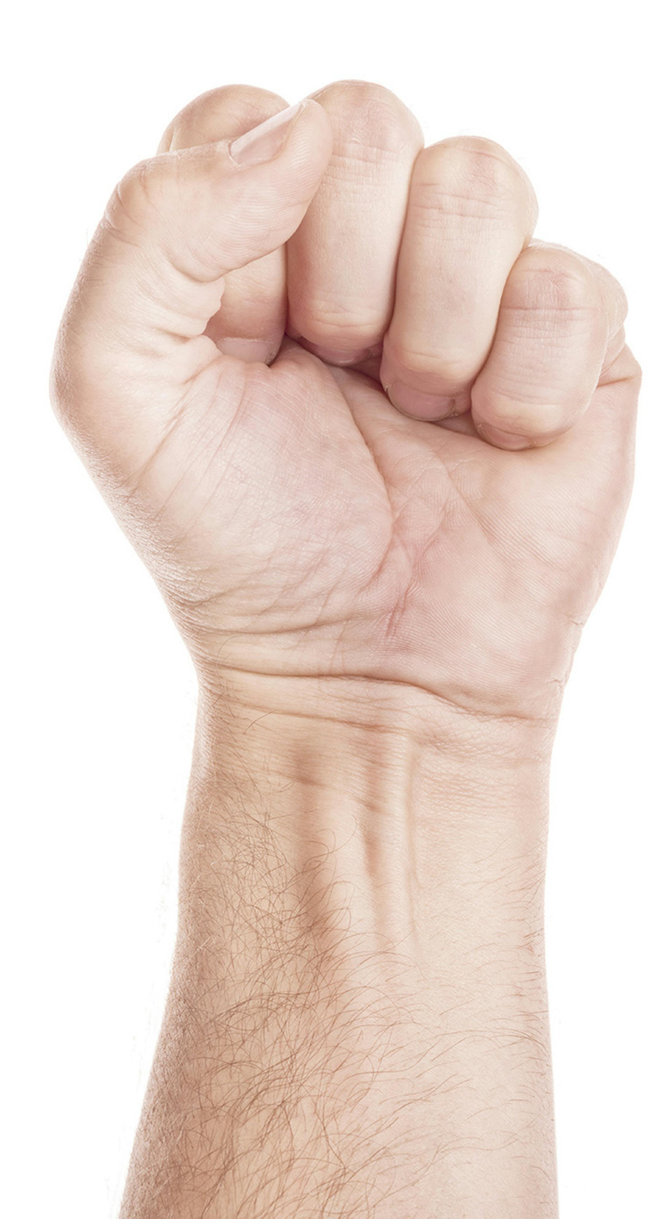 Labor movement, workers union strike concept with male fist isolated on white background raised in the air fighting for their rights.