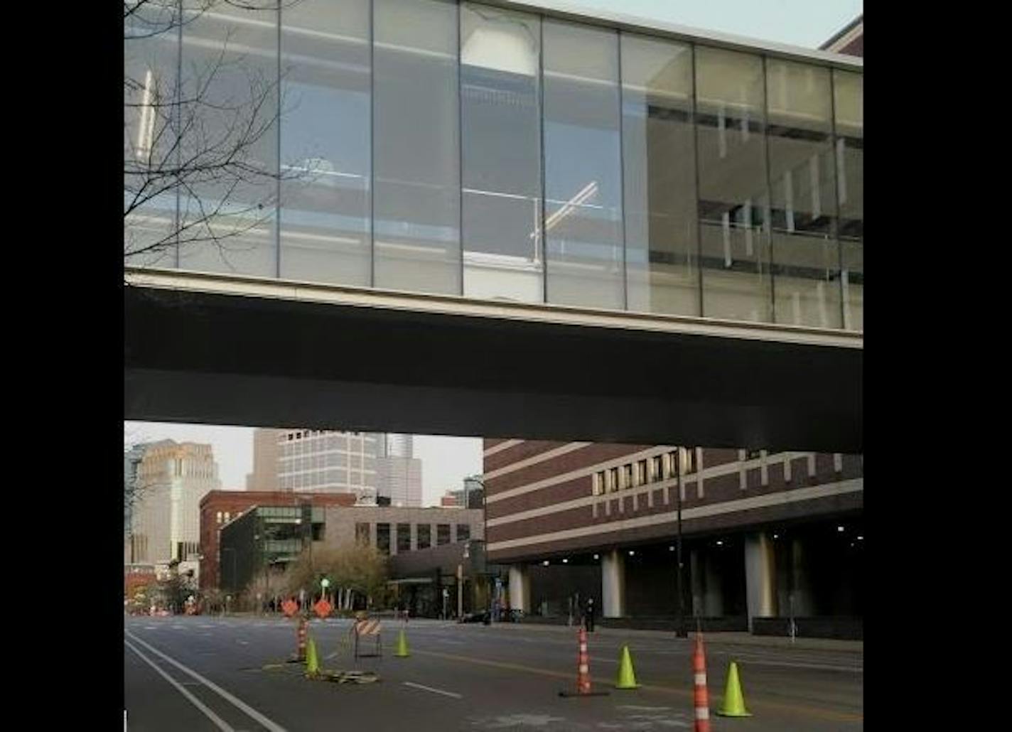 A large window fell from this skyway over Hennepin Avenue in Minneapolis and left bits of glass on the pavement. Credit: Photo by Chris Steller