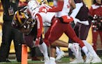 Gophers running back Mohamed Ibrahim barreled into the end zone for a second-quarter touchdown despite the efforts of Cornhuskers cornerback Lamar Jac