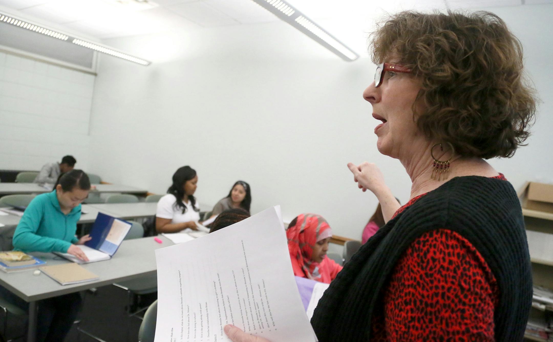 Laurel Watt is worried that proposed legislation would eliminate classes like her developmental reading class at Inver Hills Community College, that teach reading skills to struggling students -- half of the students in her class who are non-native English speakers. Here, Watt explains a handout at the end of class Tuesday, March 17, at Inver Hills Community College in Inver Grove Heights, MN.