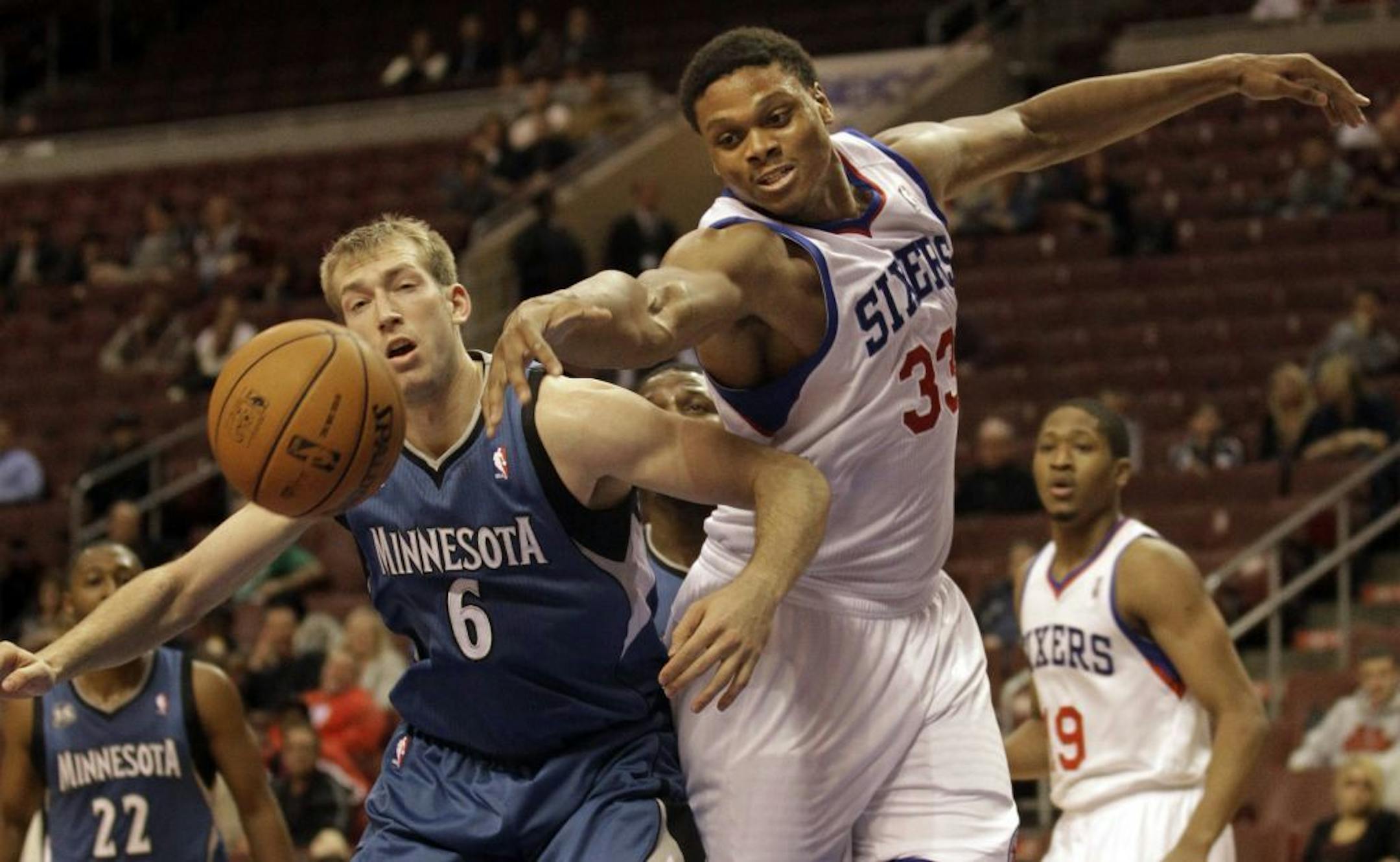 The Timberwolves' Robbie Hummel, left, and the 76ers' Daniel Orton chased a rebound in the second half of a preseason game on Oct. 23.