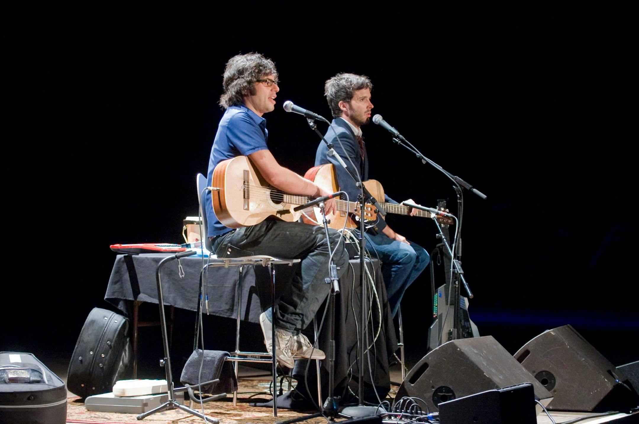 Jemaine Clement (glasses) and Bret McKenzie (no glasses), in a photo from their 2008 Minneapolis concert.