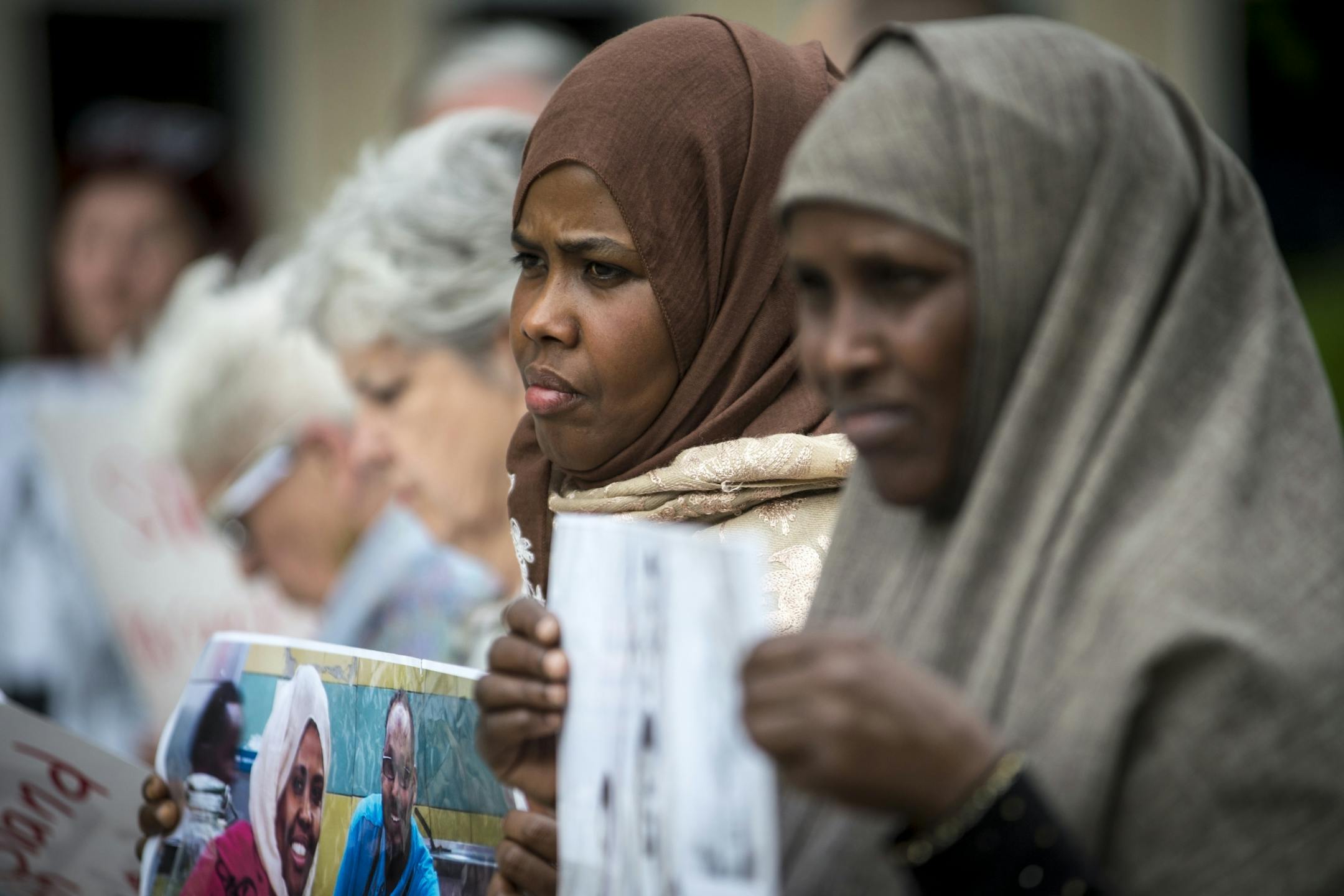 Ayan Farah, mother of Mohamed Abdihamid Farah, center, and Fadumo Hussein, mother of Guled Ali Omar, took part in a demonstration outside of the US Federal Courthouse Tuesday in support of their sons. Omar and Farah are two of the three young Somali men on trial for attempting to join ISIL.
