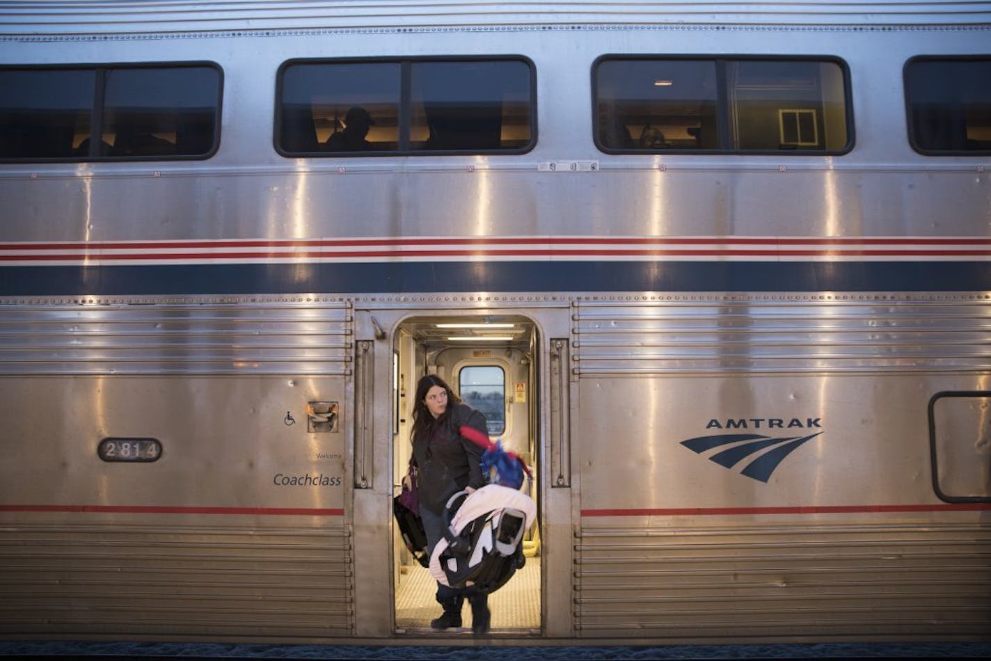 A passenger disembarks at Union Depot.