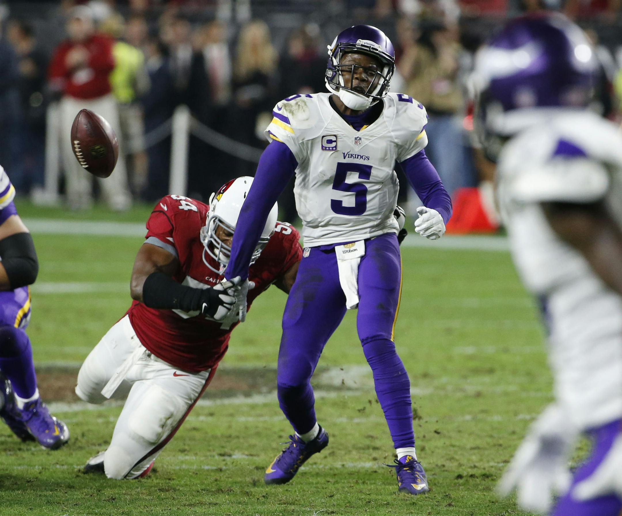 Cardinals inside linebacker Dwight Freeney (54) forces Minnesota Vikings quarterback Teddy Bridgewater (5) to fumble on the final play of the 23-20 loss to Arizona.