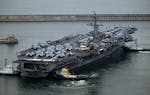 The Theodore Roosevelt (CVN 71), a nuclear-powered aircraft carrier is anchored in Busan, South Korea, Saturday, June 22, 2024. (Song Kyung-Seok/Pool 
