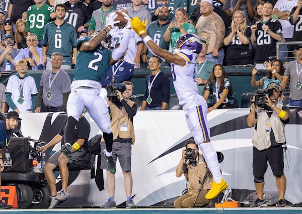 Darius Slay (2) of the Philadelphia Eagles intercepts a pass intended for Justin Jefferson (18) of the Minnesota Vikings in the fourth quarter Monday,