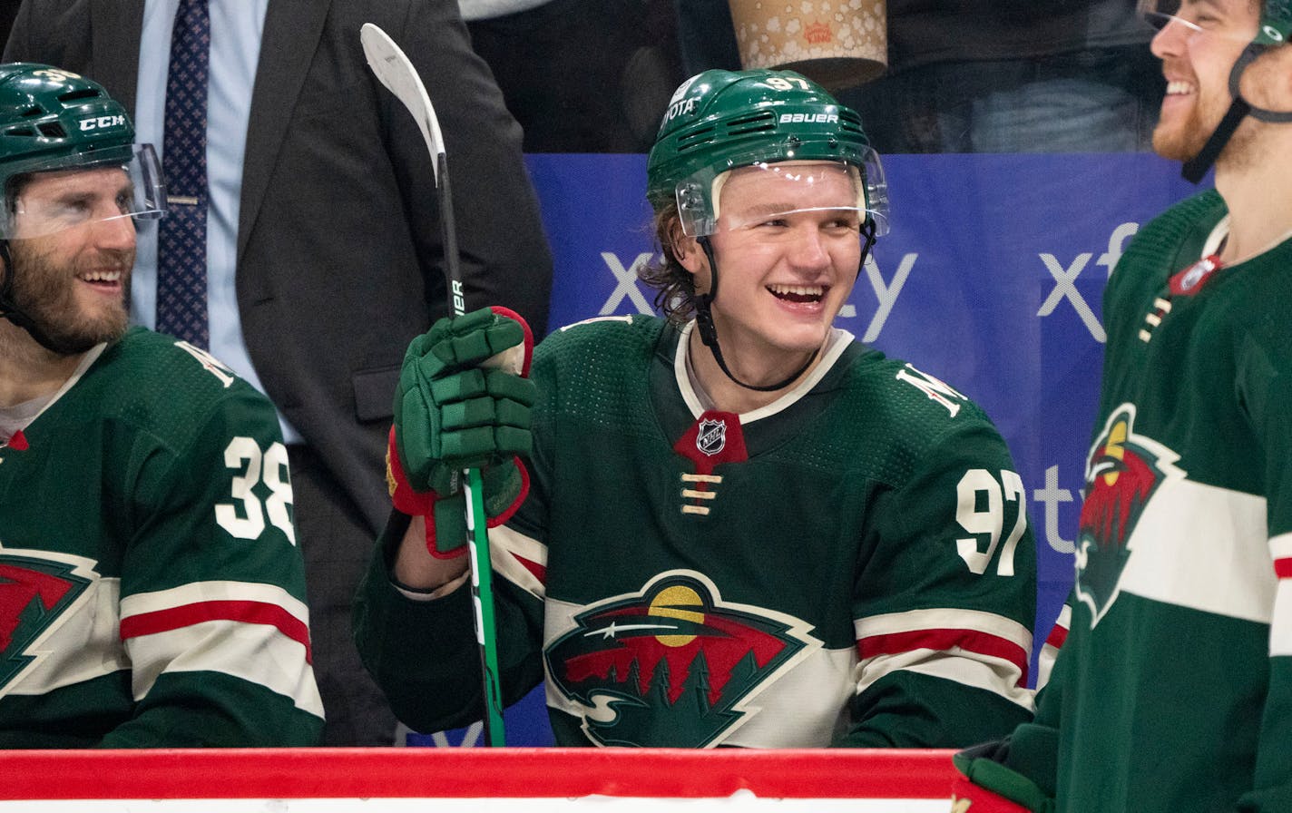 Minnesota Wild left wing Kirill Kaprizov (97) smiles as the announcement is made that he recorded his 100th point of the season in the second period Friday, April, 22, 2022 at Xcel Energy Center in St. Paul, Minn. ]