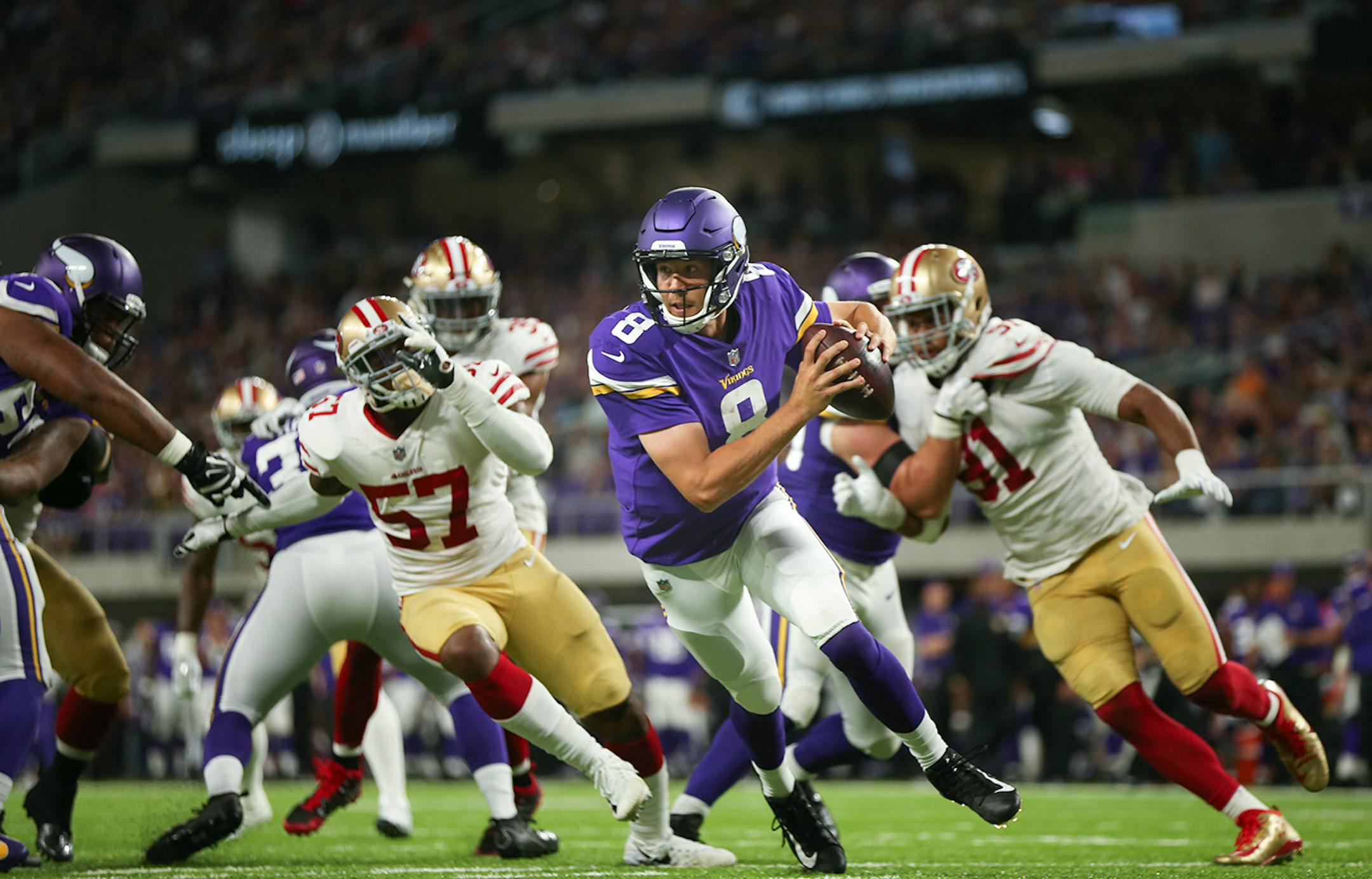 Minnesota Vikings quarterback Sam Bradford (8) scrambled out of the pocket to elude San Francisco outside linebacker Eli Harold (57) and defensive end Arik Armstead (91) in the second quarter. ] JEFF WHEELER ï jeff.wheeler@startribune.com The Minnesota Vikings met the San Francisco 49ers in their third game of the NFL preseason Sunday night, August 27, 2017 at U.S. Bank Stadium in Minneapolis.