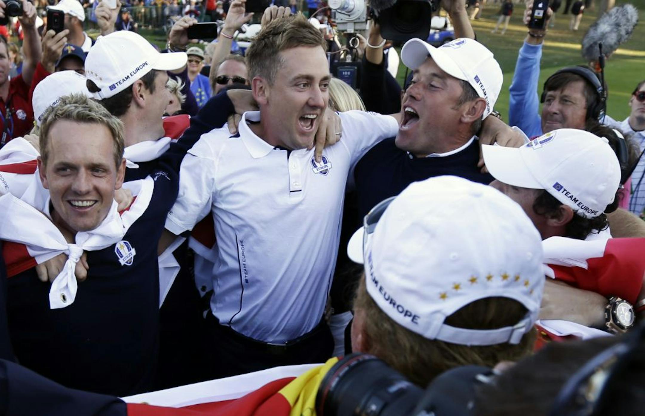 From left, Europe's Luke Donald, Ian Poulter, and Lee Westwood reveled in their team's unlikely comeback against the U.S. to retain the Ryder Cup.