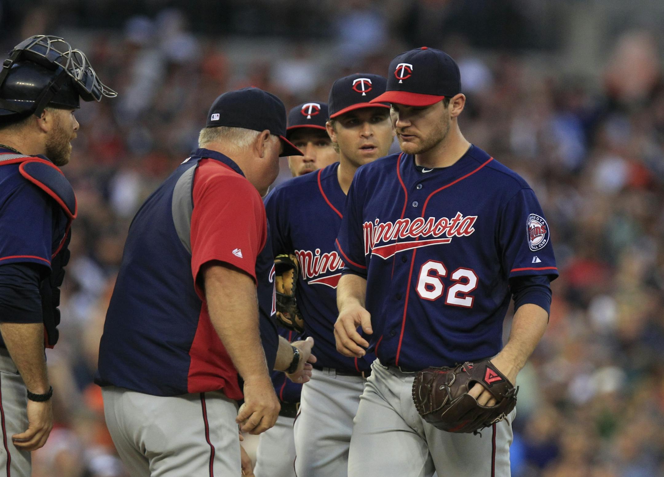 Minnesota Twins starting pitcher Liam Hendriks is pulled by manager Ron Gardenhire during the fifth inning of a baseball game against the Detroit Tigers in Detroit, Monday, July 2, 2012.