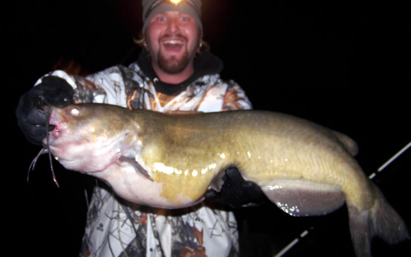 2007: Luke Urevig, 22, of Pine Island, Minn., holds a 49-inch channel catfish he caught in Lake Zumbro near Rochester. The fish, which Urevig estimated weighed at least 40 pounds, may have been a new state record, but Urevig released it.