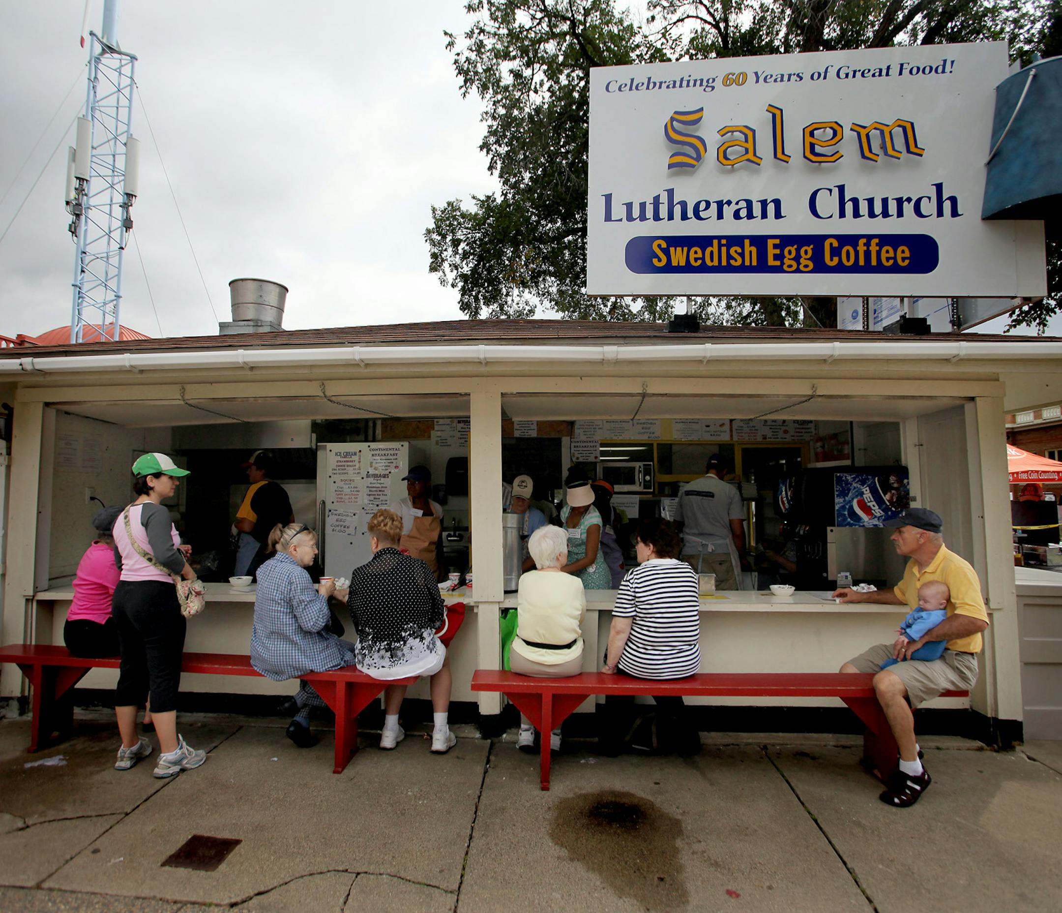 ELIZABETH FLORES • eflores@startribune.com August 28, 2009 - Falcon Heights, MN - Fairgoers gathered at the Salem Lutheran Church Diner for breakfast at the Minnesota State Fair. The food establishment has been operating for more than 60 years. There used to be dozens of dining halls run by church volunteers at the fair and now there are just four. ORG XMIT: MIN2013080507131503