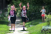 Walkers participating in the Susan G Komen 3-Day approach pit stop 3 near Brackett Recreation Center Friday, Aug. 16, 2019, in Minneapolis, MN. Here, 