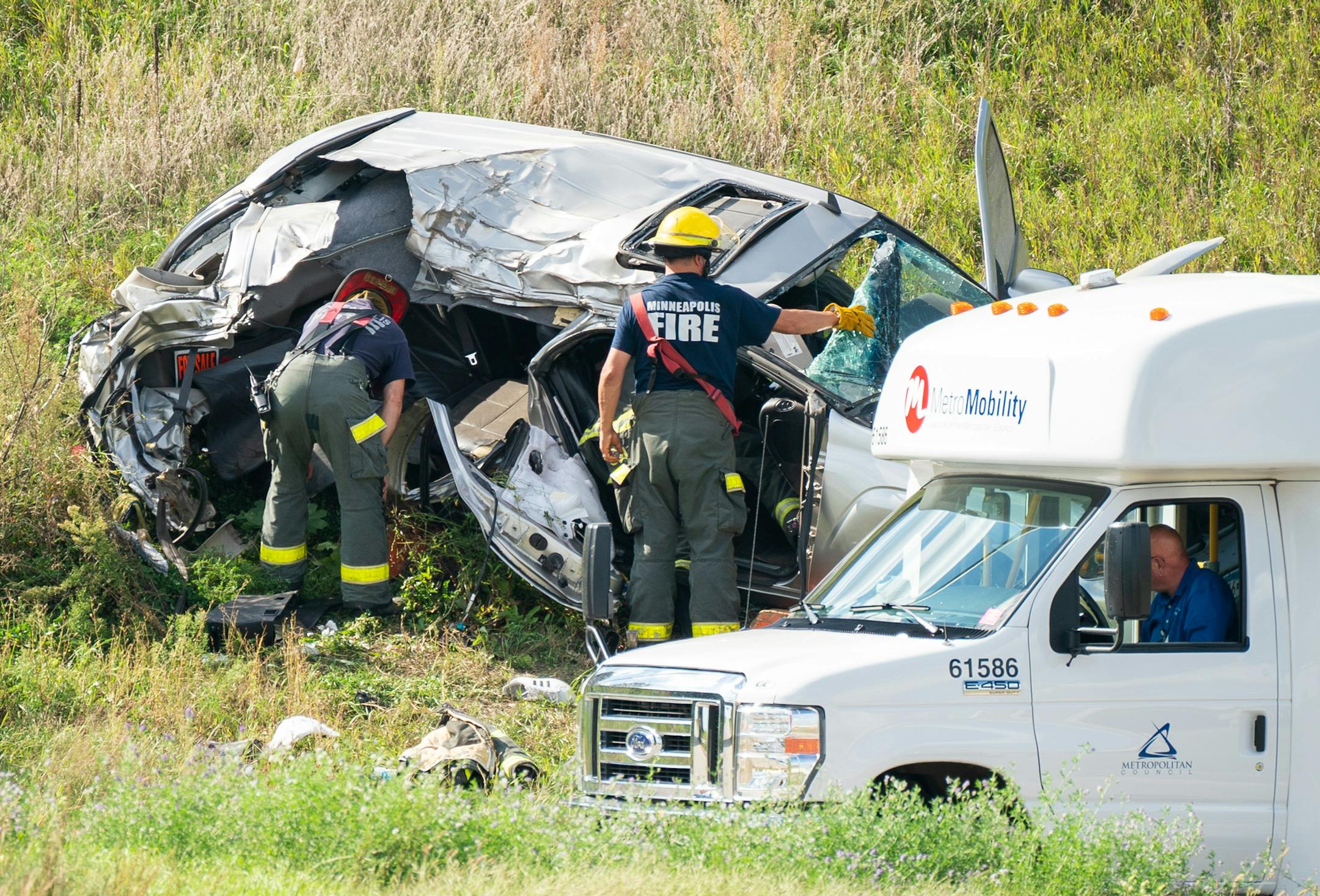 Firefighters searched a vehicle at the scene of a fatal crash at W Broadway Ave and I-94 in Minneapolis. ] GLEN STUBBE &#xef; glen.stubbe@startribune.com Sunday, September 16, 2018