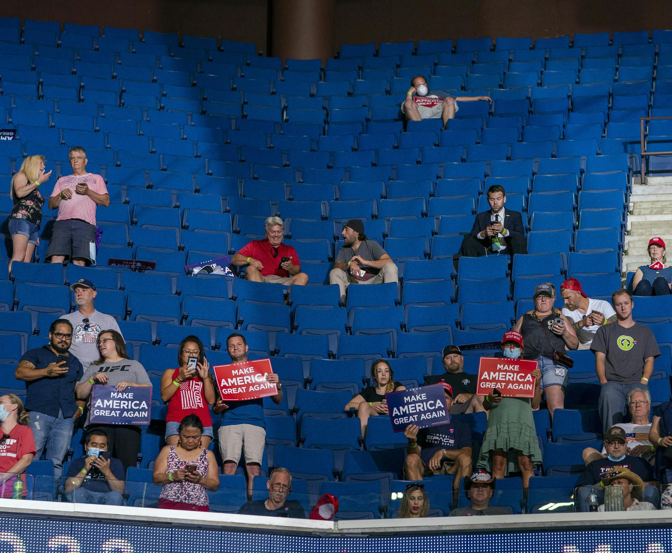 Supporters of President Donald Trump listen as he speaks at the BOK Center in Tulsa on Saturday, June 20, 2020, during his first campaign rally since March 2. Many of the arena's 19,000 seats remained empty as Trump spoke. (Doug Mills/The New York Times)