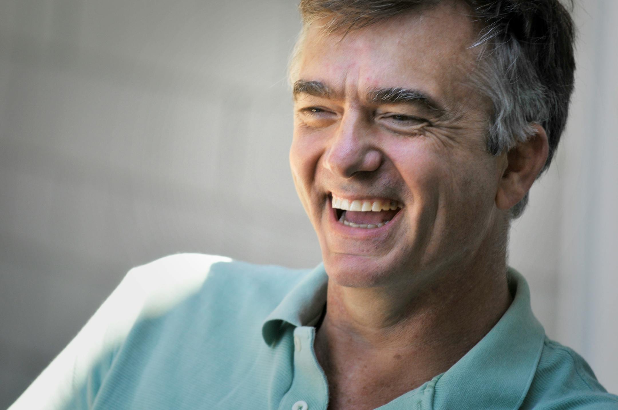 Mark Kroll sits on the deck of his Crystal Bay home overlooking Lake Minnetonka. Krollholds 270 patents, most in the medical science field.