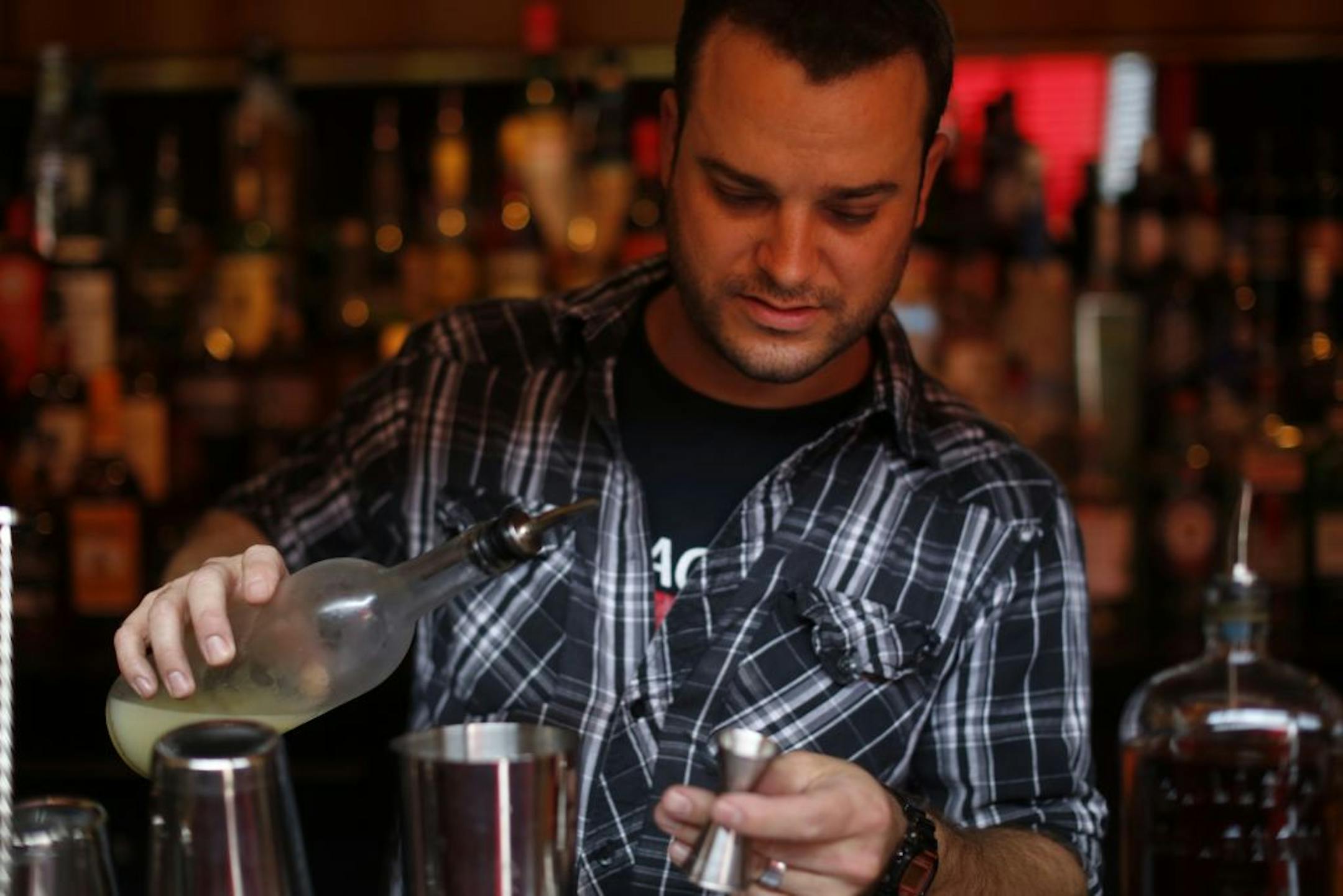 At the Cafe Maude in Loring Park, mixologist Adam Harness worked on the Civilized Leisure, which consists of Bulliet bourbon, yellow Chartreuse, lemon and honey syrup.