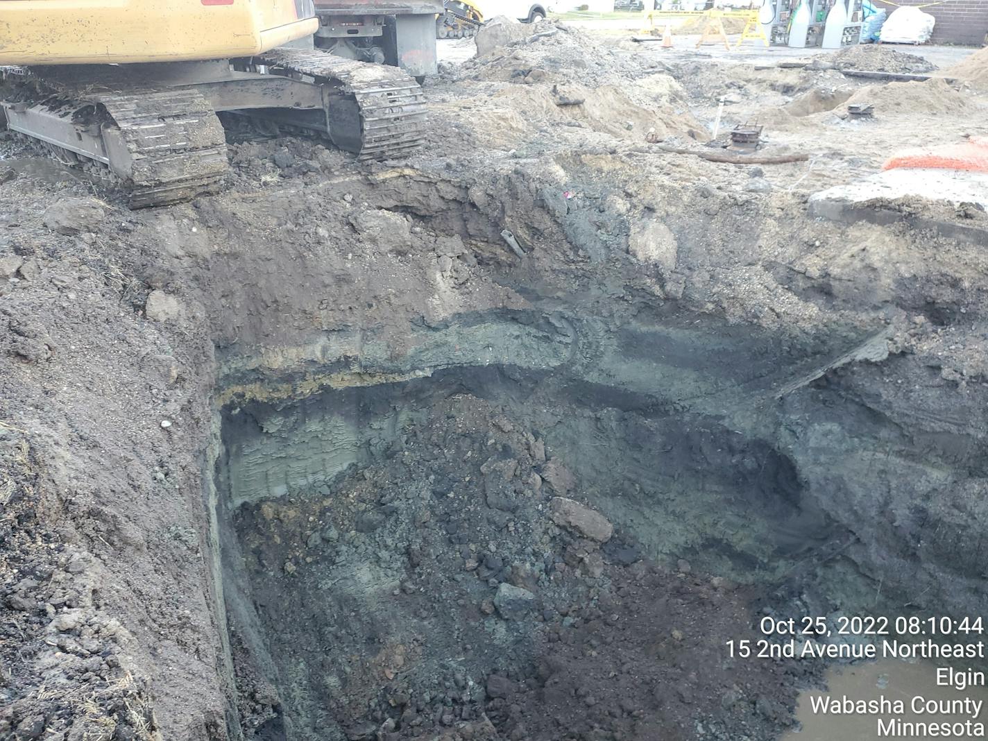 Gray petroleum-contaminated soil is excavated at the site of a Cenex gas station leak on Oct. 25, 2022.