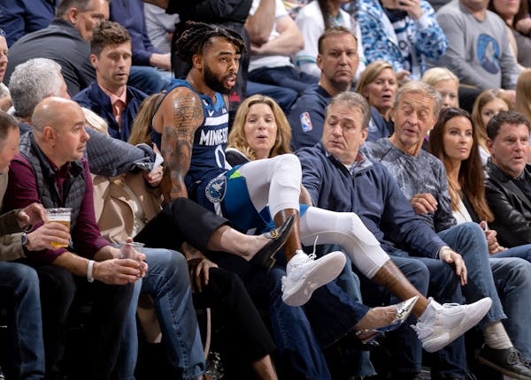 D’Angelo Russell of the Wolves fell into the crowd during Wednesday night’s loss to the Suns at Target Center. The Wolves play at Memphis on Frida
