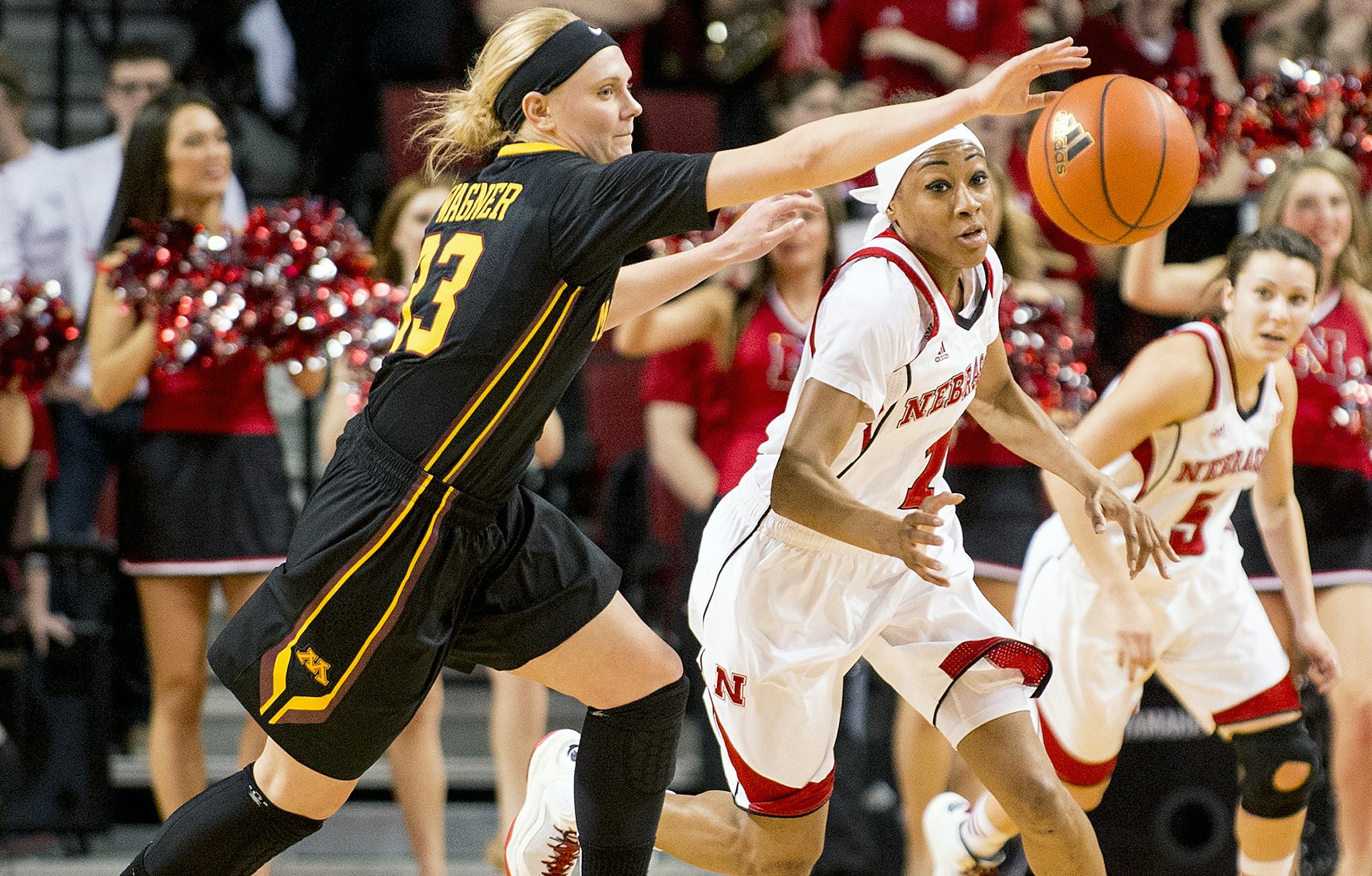 Nebraska guard Tear’a Laudermill (1) and Minnesota guard Carlie Wagner (33) vie for the loose ball in the second half of an NCAA basketball game on Tuesday, Feb. 24, 2015, in Lincoln, Neb. (AP Photo/The Journal-Star, Francis Gardler)