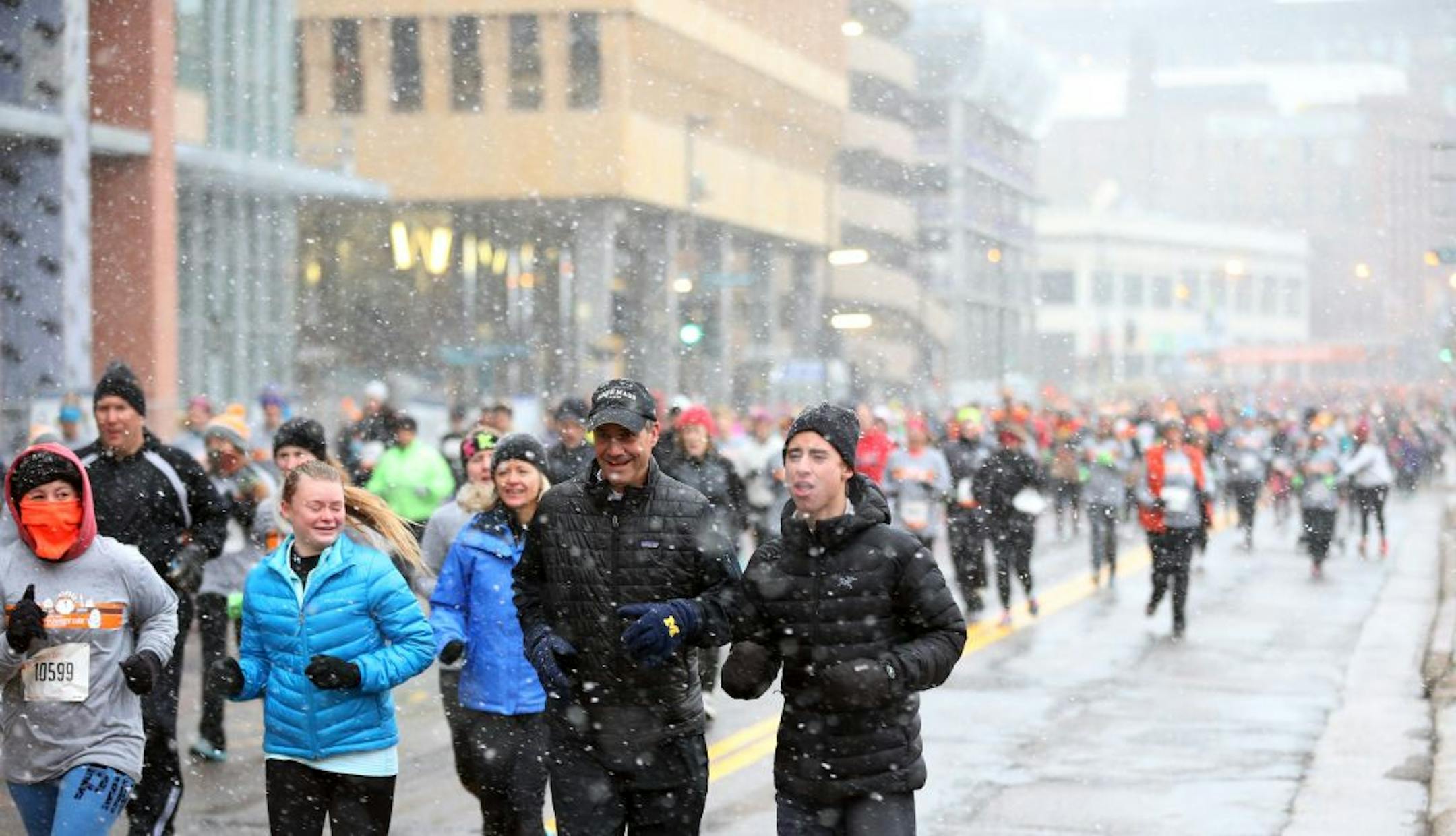 Light snow fell on runners in the 5k Turkey Day Run Thursday November 26, 2015 in Minneapolis.
