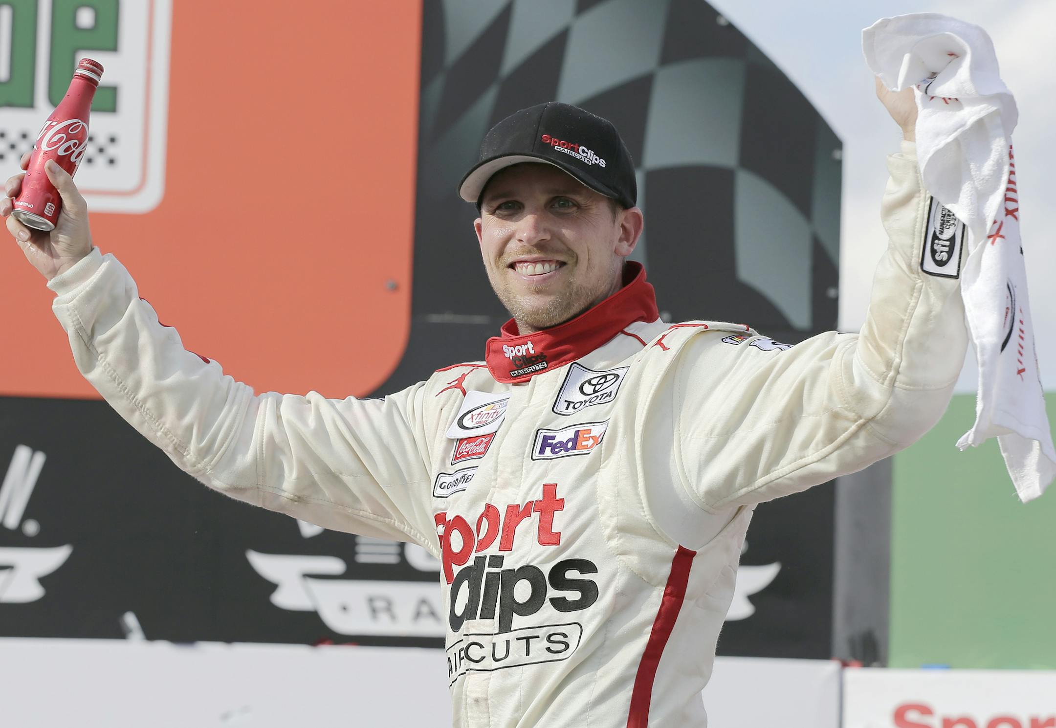 Denny Hamlin celebrates after winning the NASCAR Xfinity auto race at Darlington Raceway, Saturday, Sept. 2, 2017, in Darlington, S.C. (AP Photo/Terry Renna)